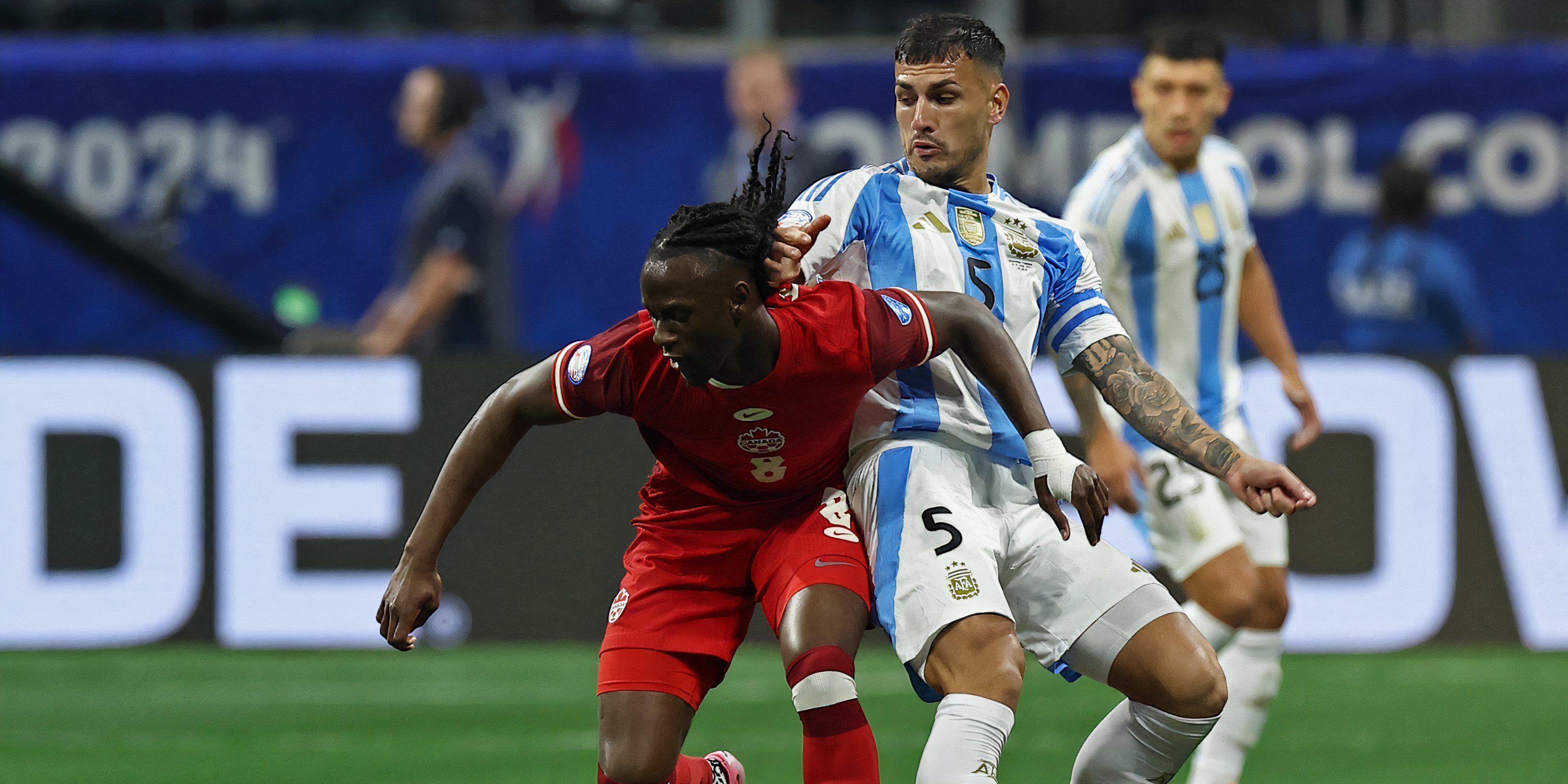 Canada midfielder Ismael Kone battling for possession against Argentina