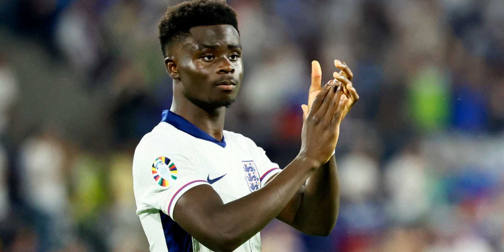 Bukayo Saka applauding England fans