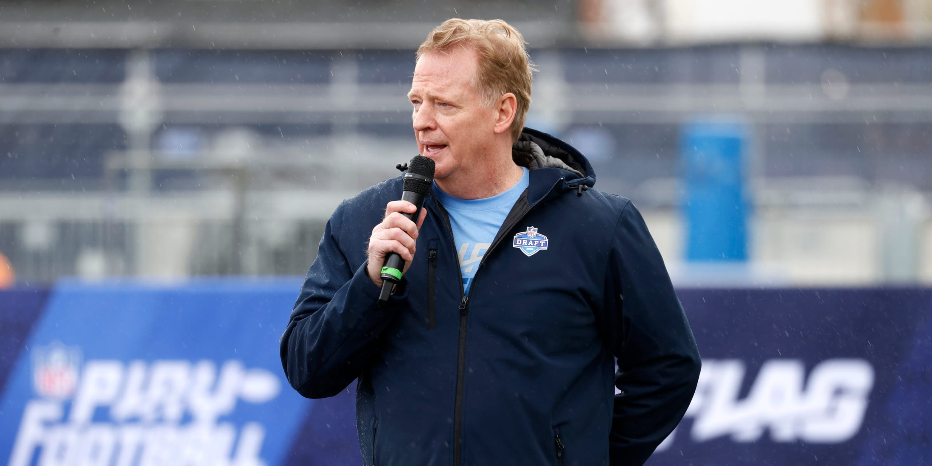 Roger Goodell speaking in the rain