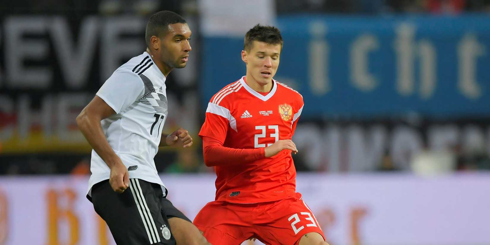 Tah (left) in action for Germany against Russia