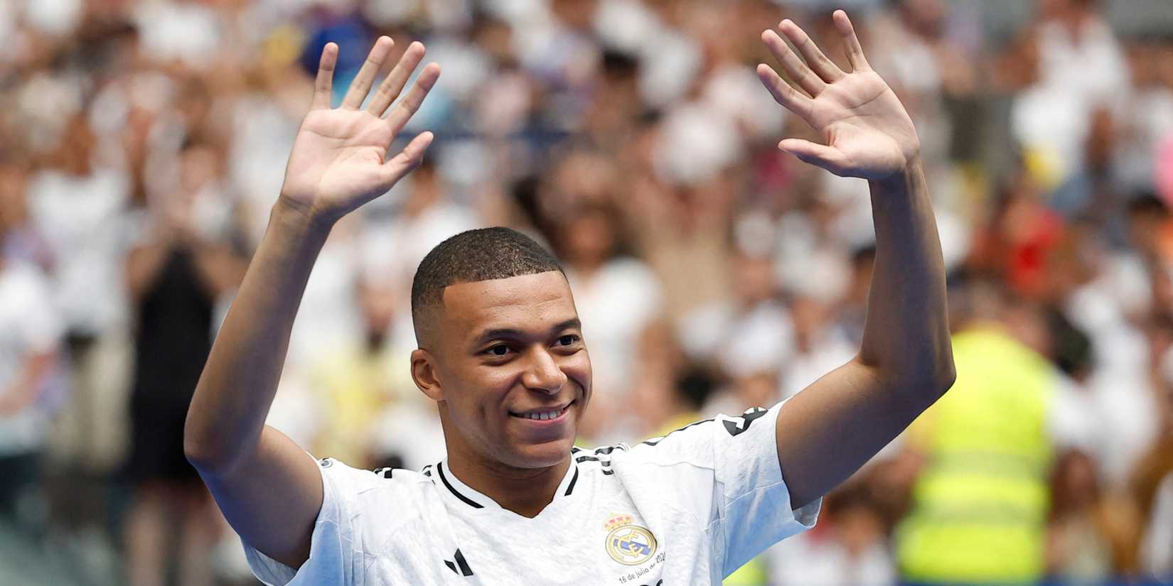 Kylian Mbappe waving during Real Madrid presentation