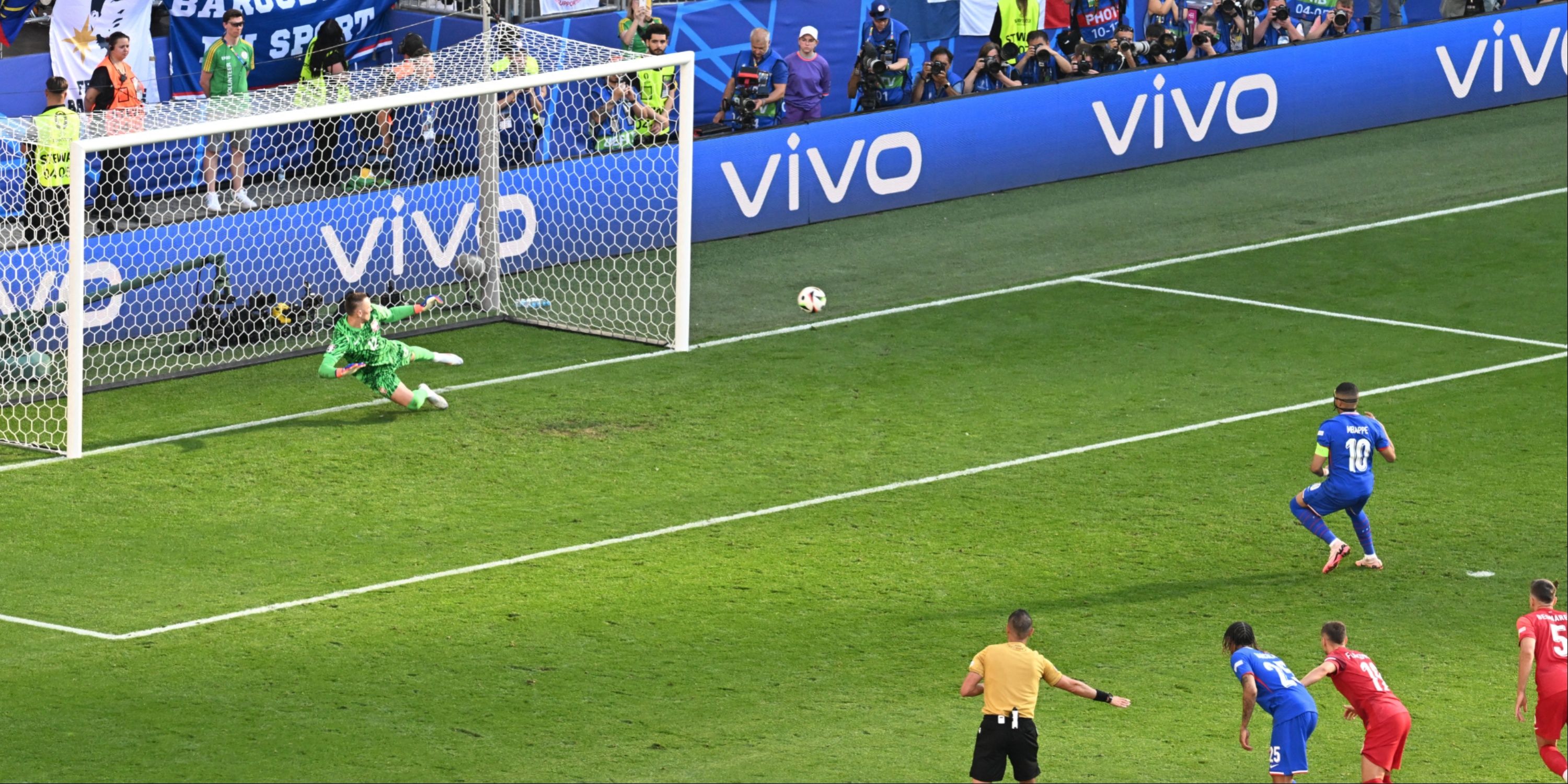 Kylian Mbappe scores a penalty for France