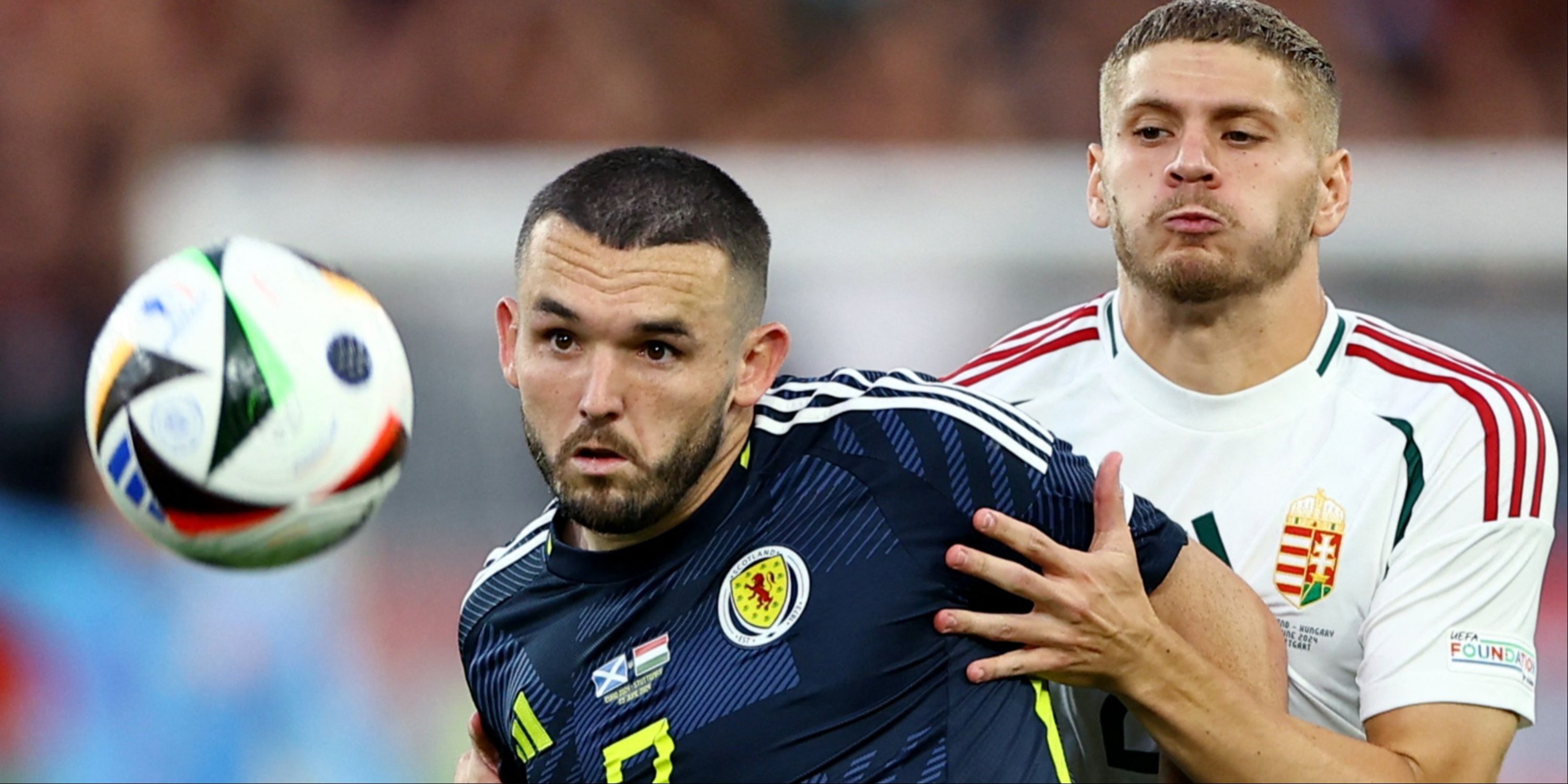 John McGinn battles for the ball for Scotland