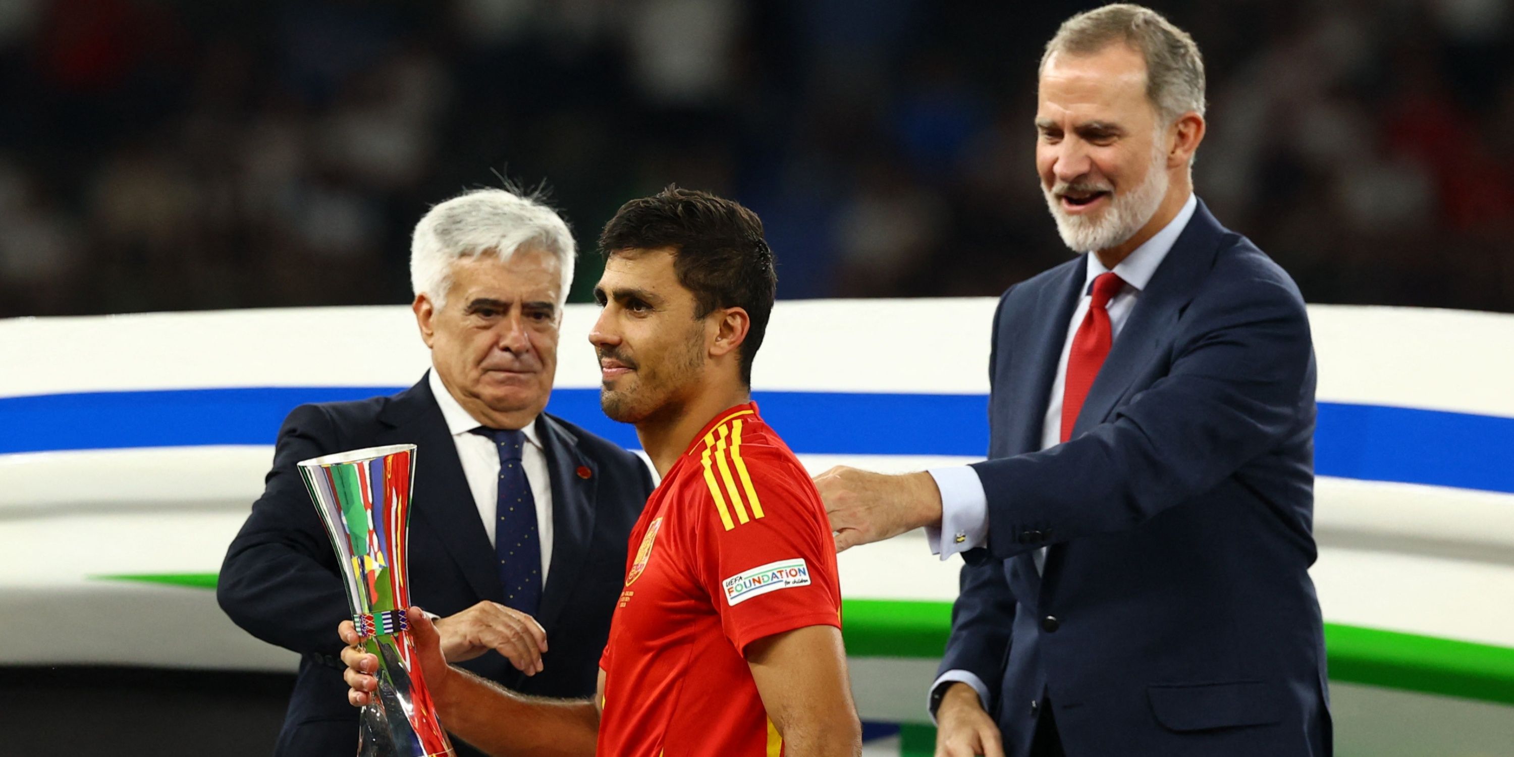 Spain's Rodri holds his award for player of the tournament