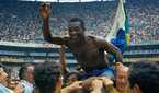 Pele is lifted up by his team-mates after Brazil's 1970 World Cup success.