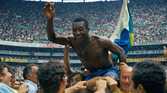 Pele is lifted up by his team-mates after Brazil's 1970 World Cup success.