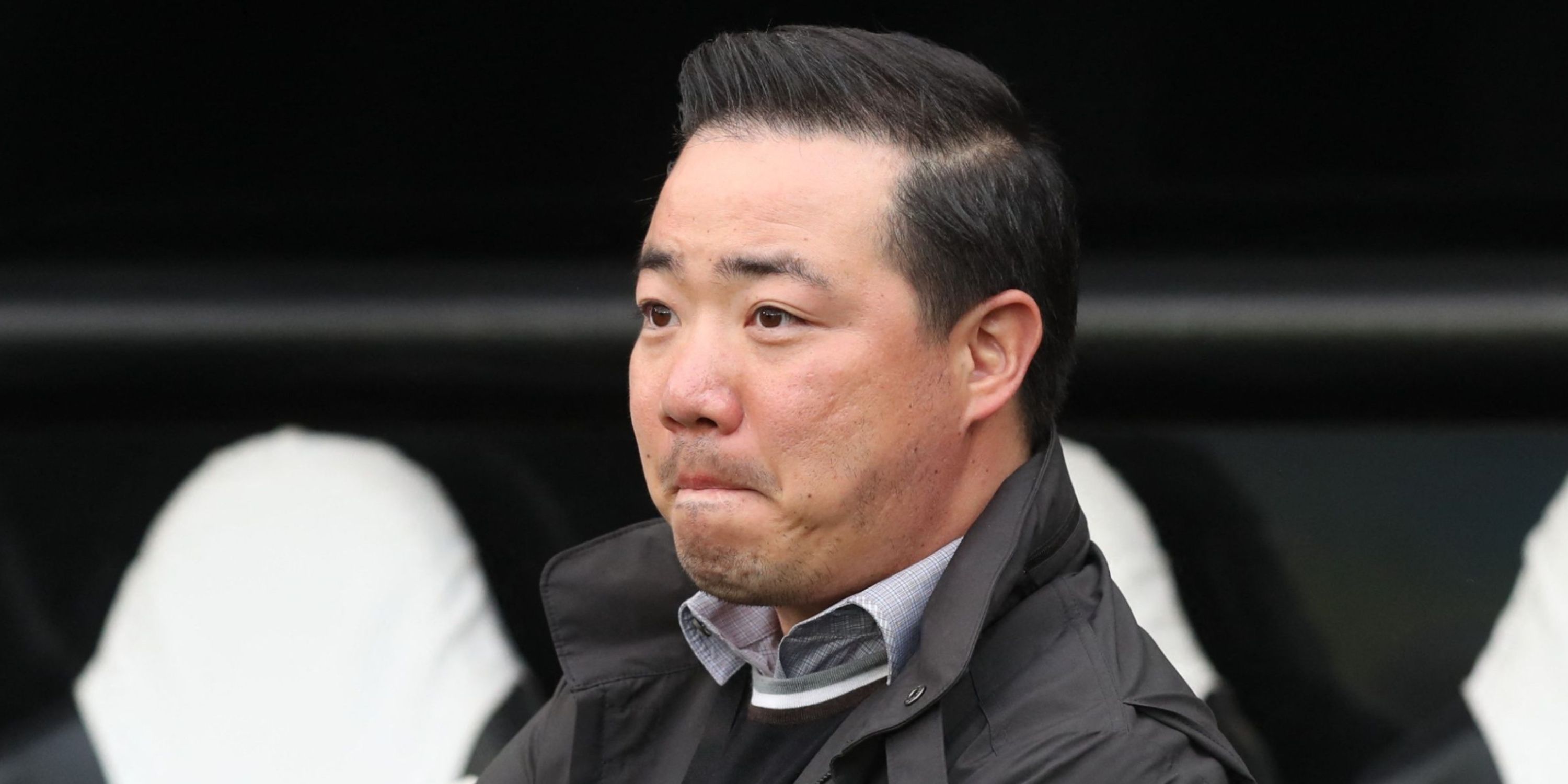 Leicester City owner Aiyawatt Srivaddhanaprabha in front of the dugout