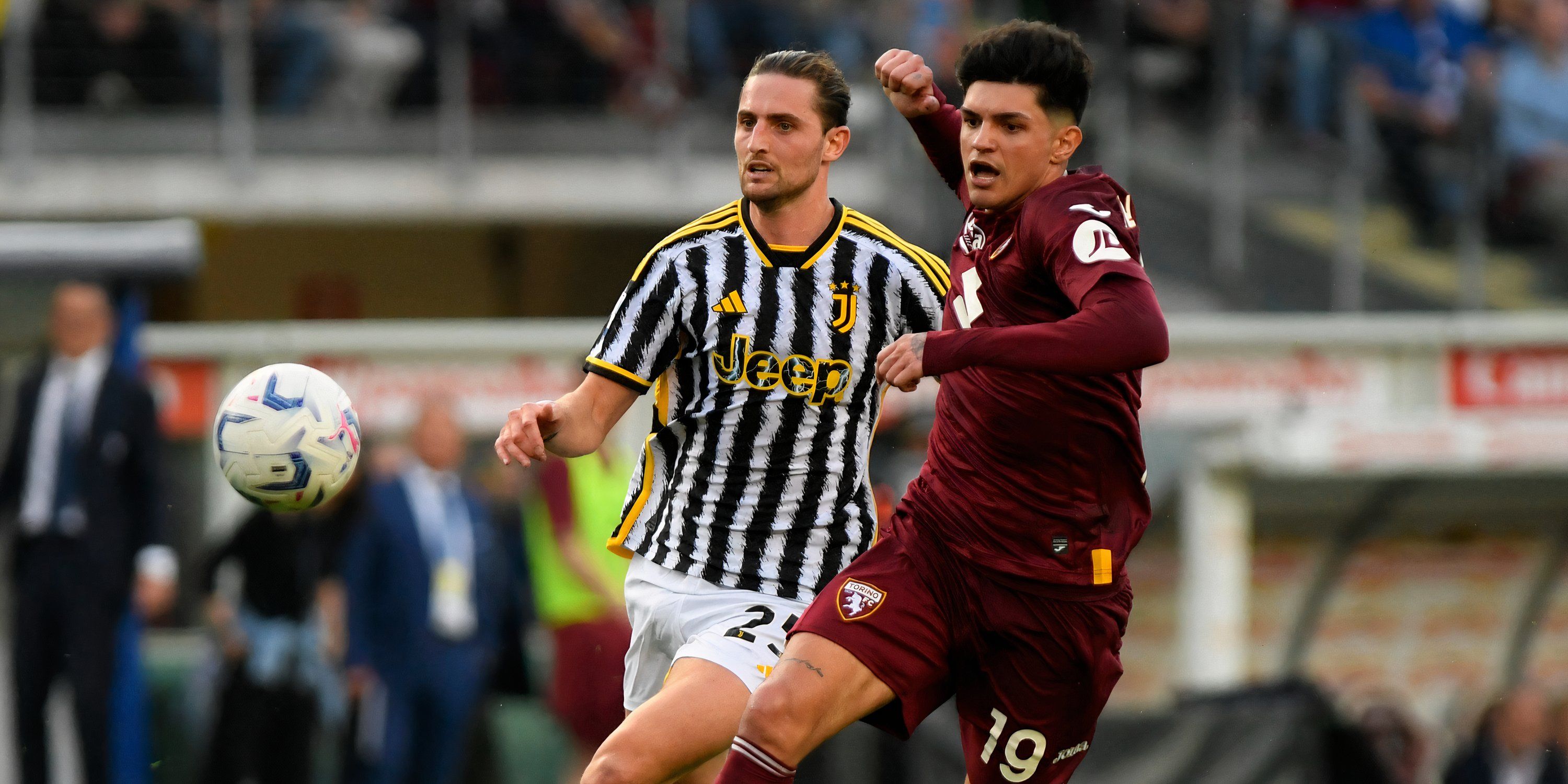 Juventus midfielder Adrien Rabiot and Torino right-back Raoul Bellanova battling for possession