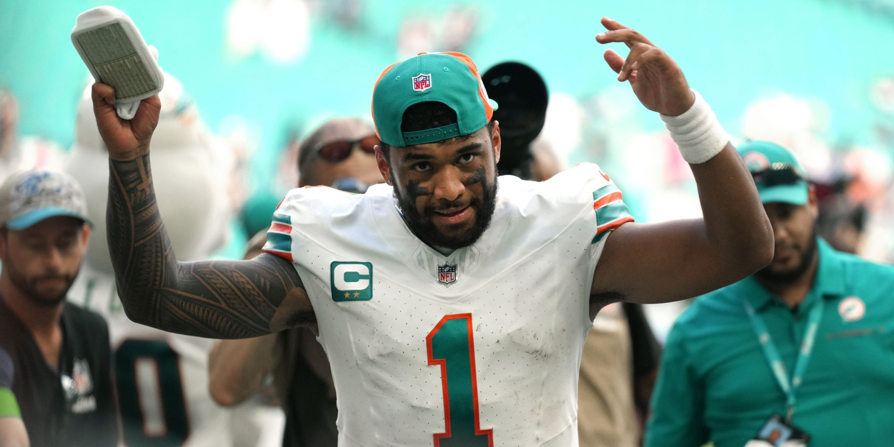 Miami Dolphins QB Tua Tagovailoa hypes up the crowd after a win