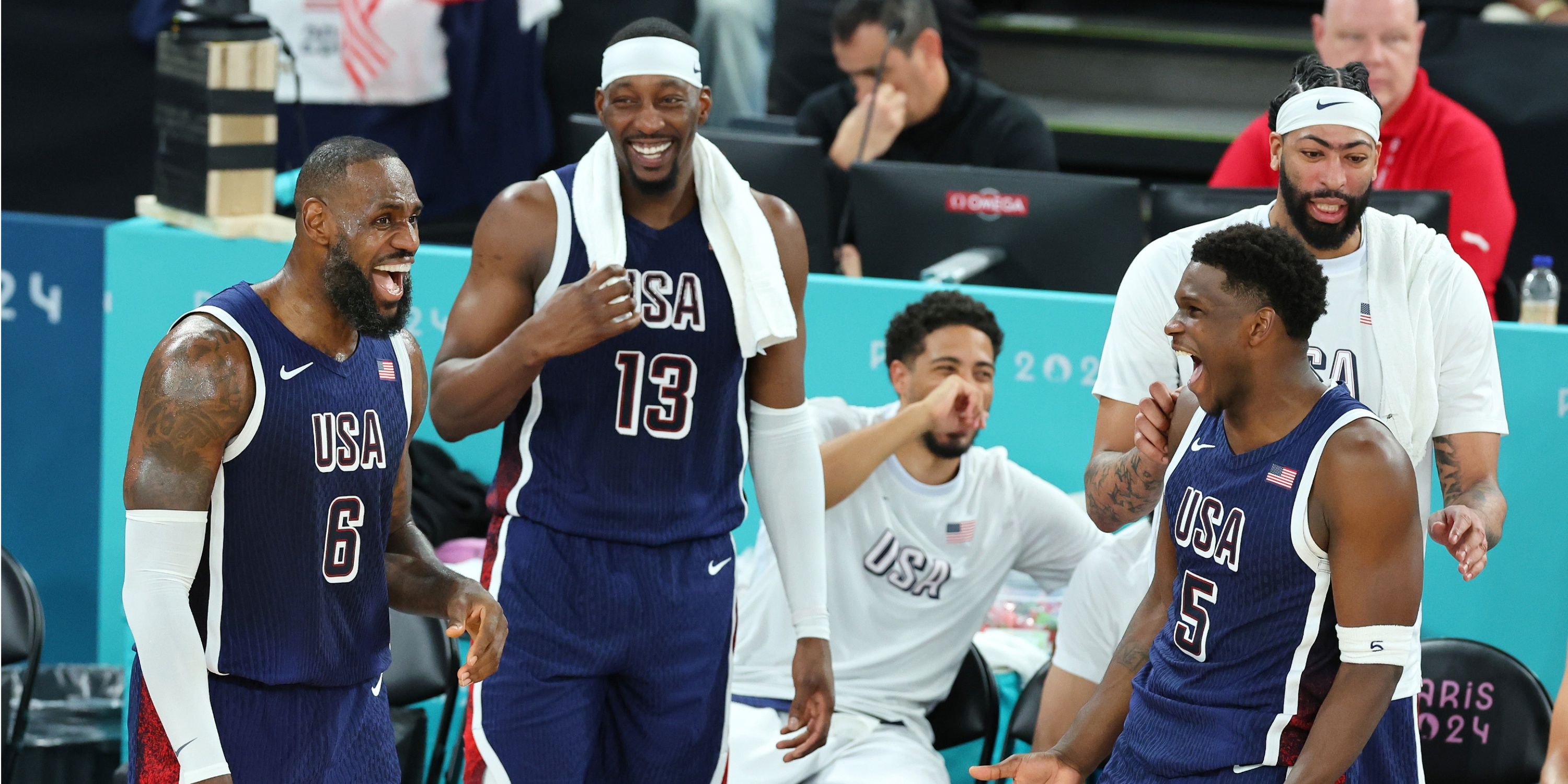 LeBron James, Bam Adebayo, Anthony Edwards of Team USA laugh on the sideline