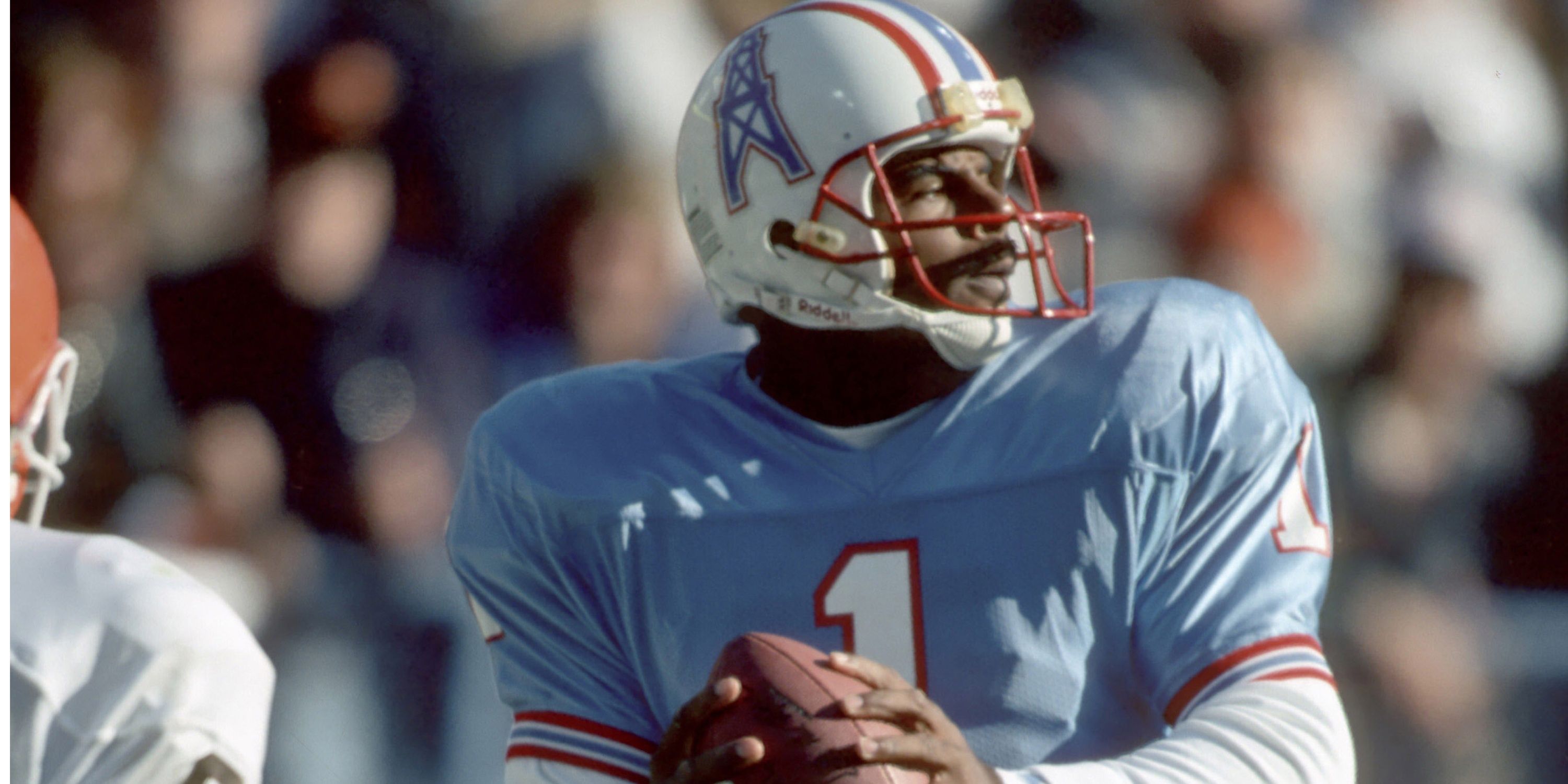 Houston Oilers QB Warren Moon drops back to pass