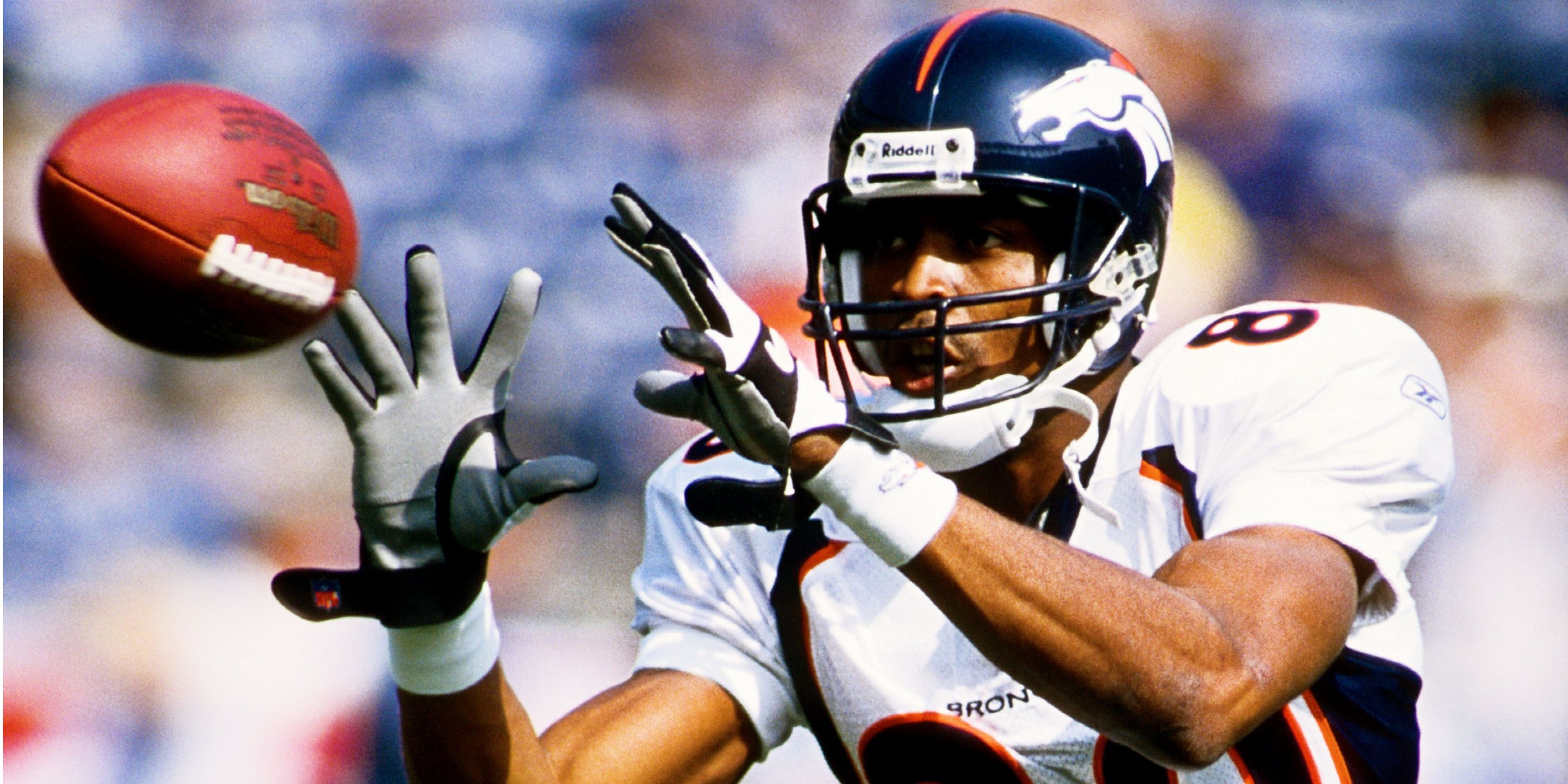 Denver Broncos Wide Receiver Rod Smith making a catch from John Elway