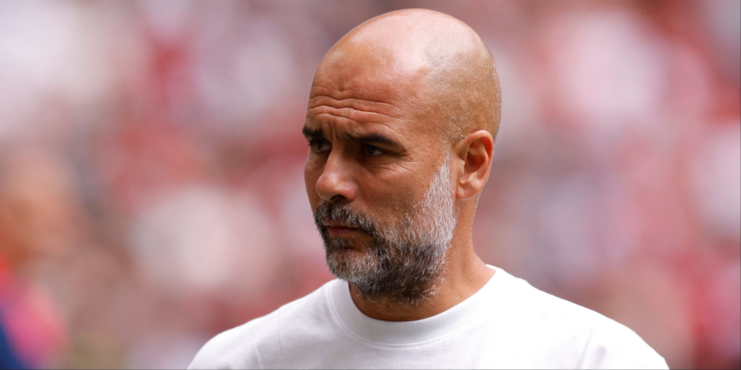 Manchester City boss Pep Guardiola watching on from the touchline