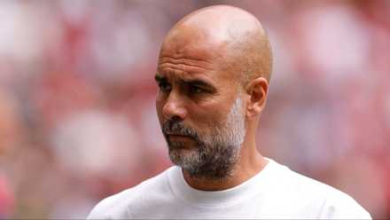 Manchester City boss Pep Guardiola watching on from the touchline