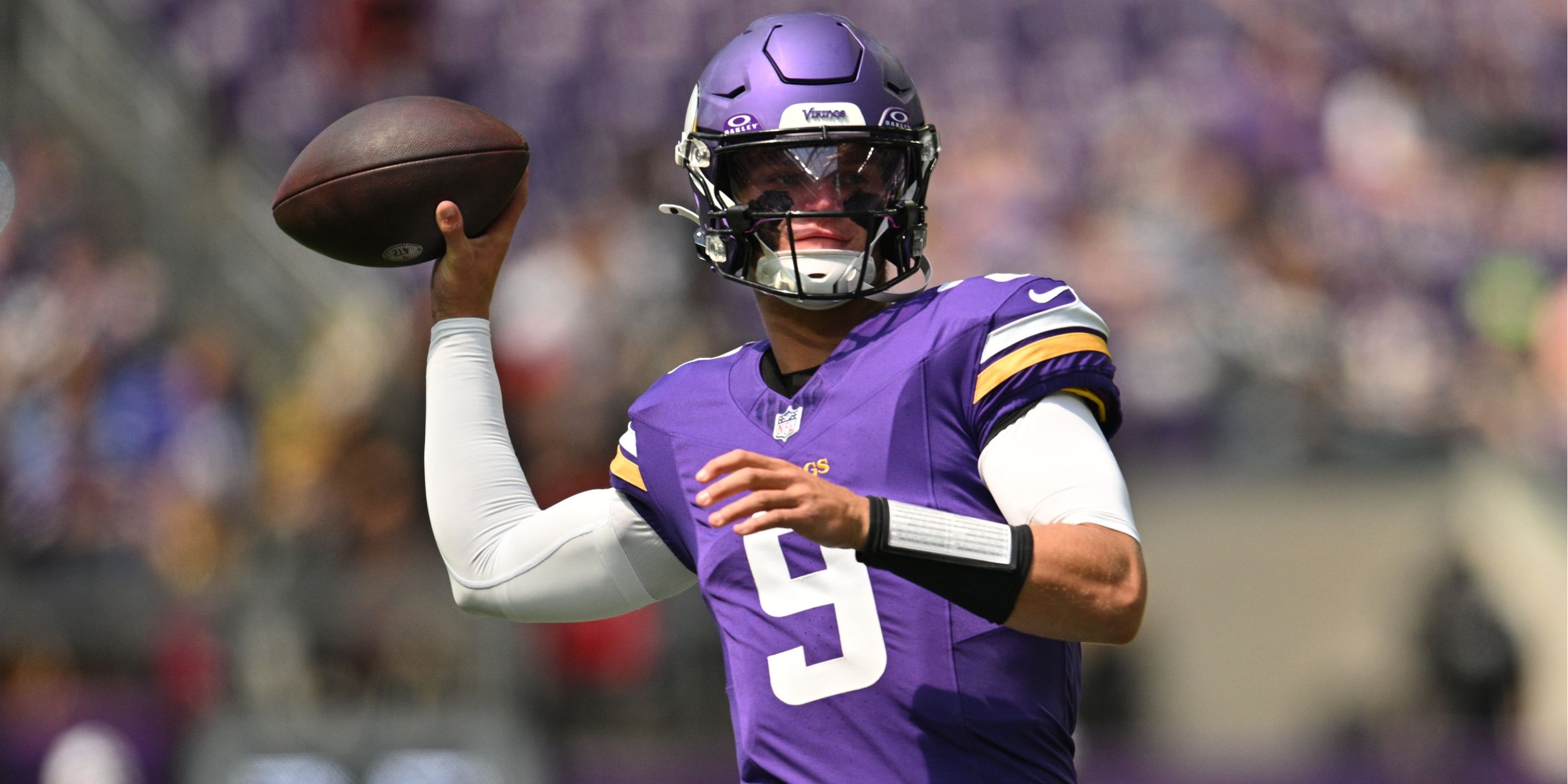 Minnesota Vikings QB J.J. McCarthy drops back to pass during pre-season game