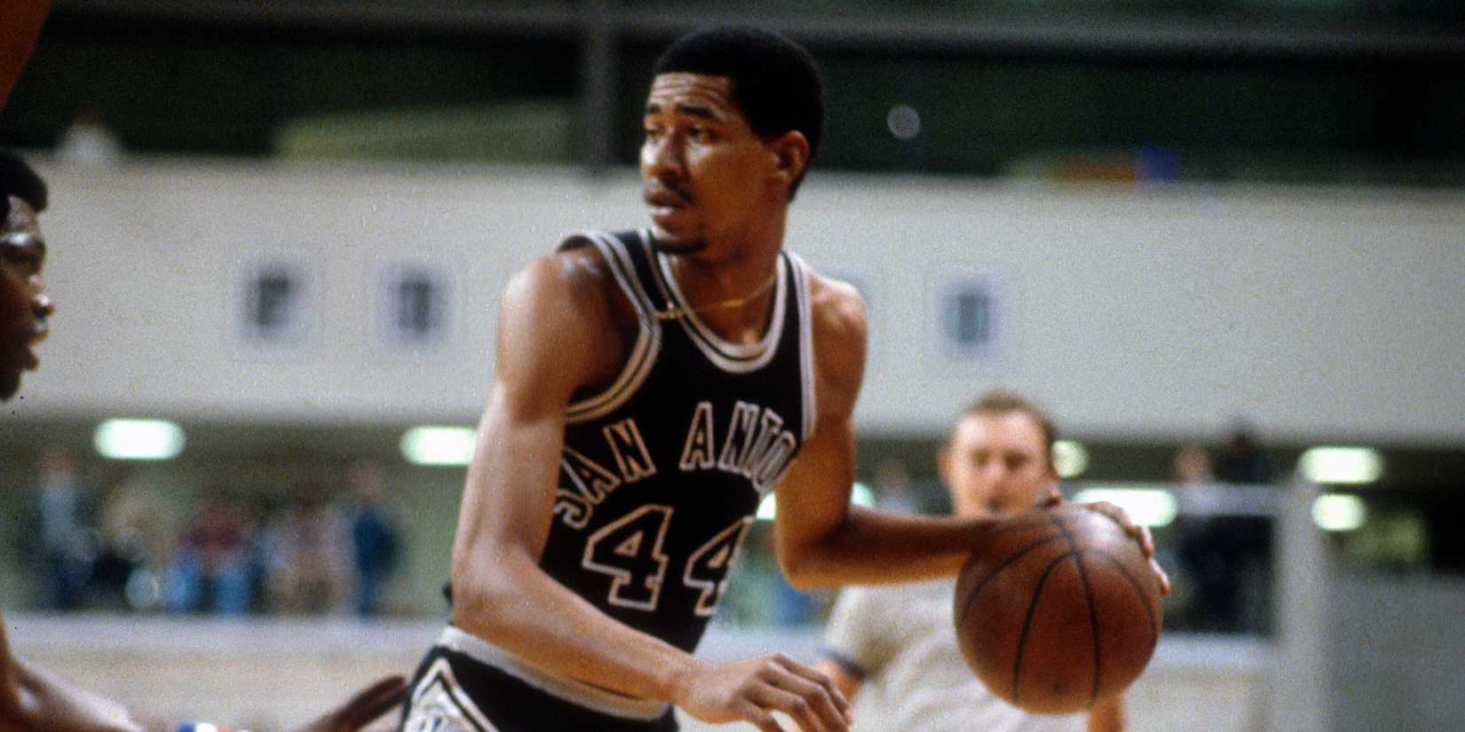 George Gervin of the San Antonio Spurs dribbles the ball