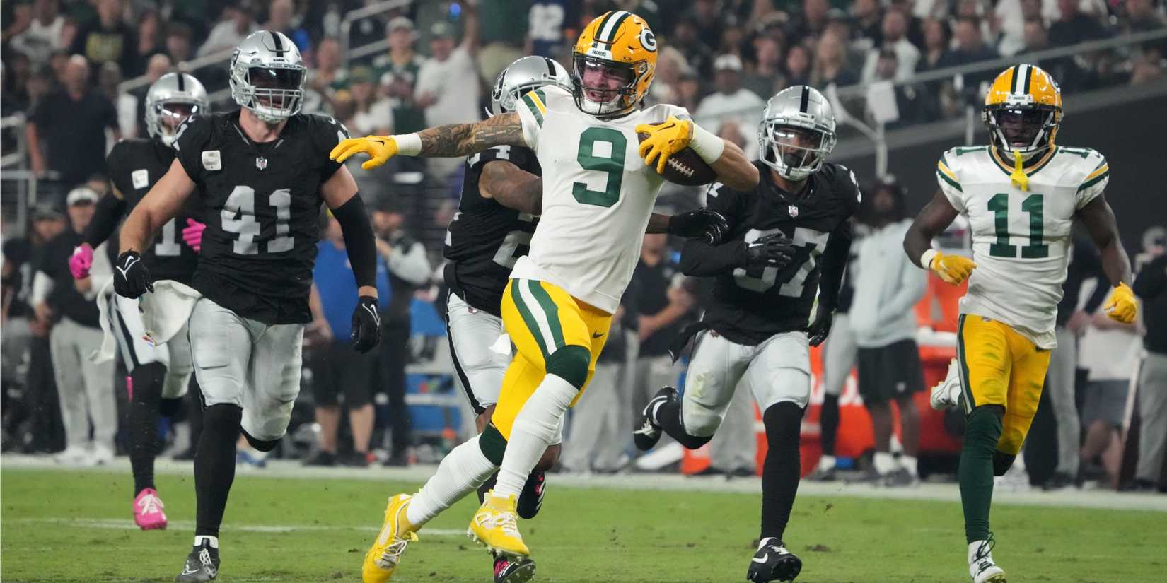 Packers WR Christian Watson runs after the catch