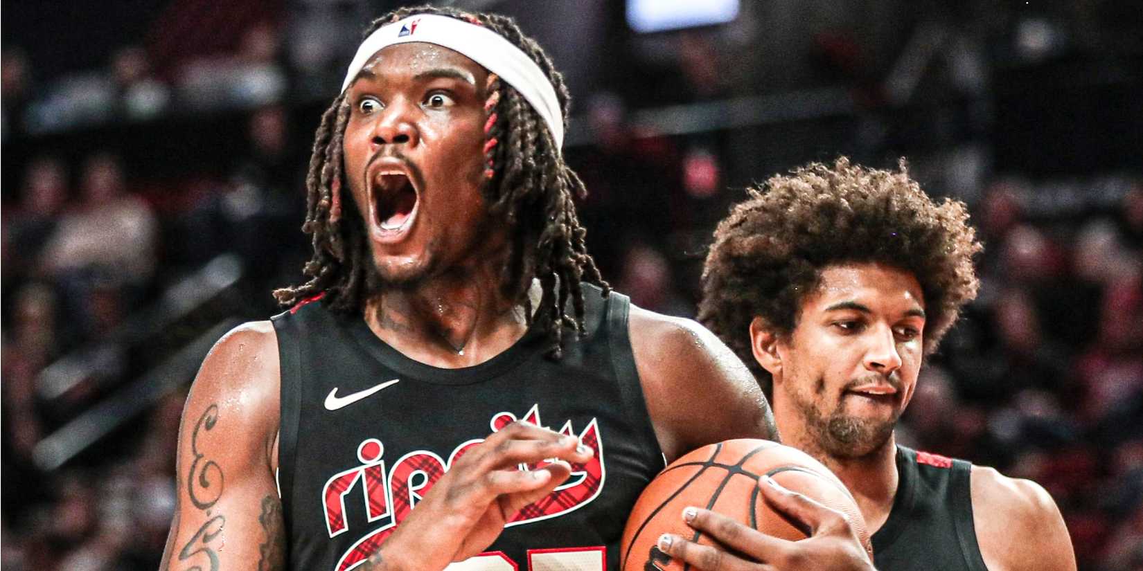 Robert Williams III of the Portland Trail Blazers reacts to a play during an NBA game.