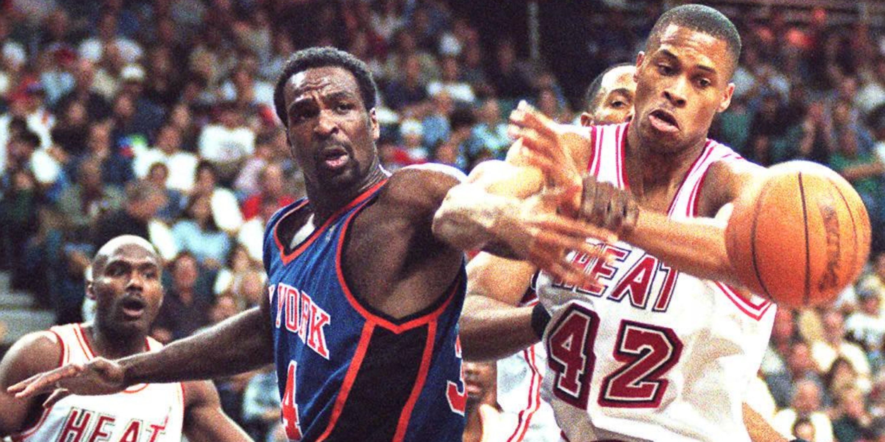 Charles Oakley of the New York Knicks fights for a rebound with PJ Brown of the Miami Heat.
