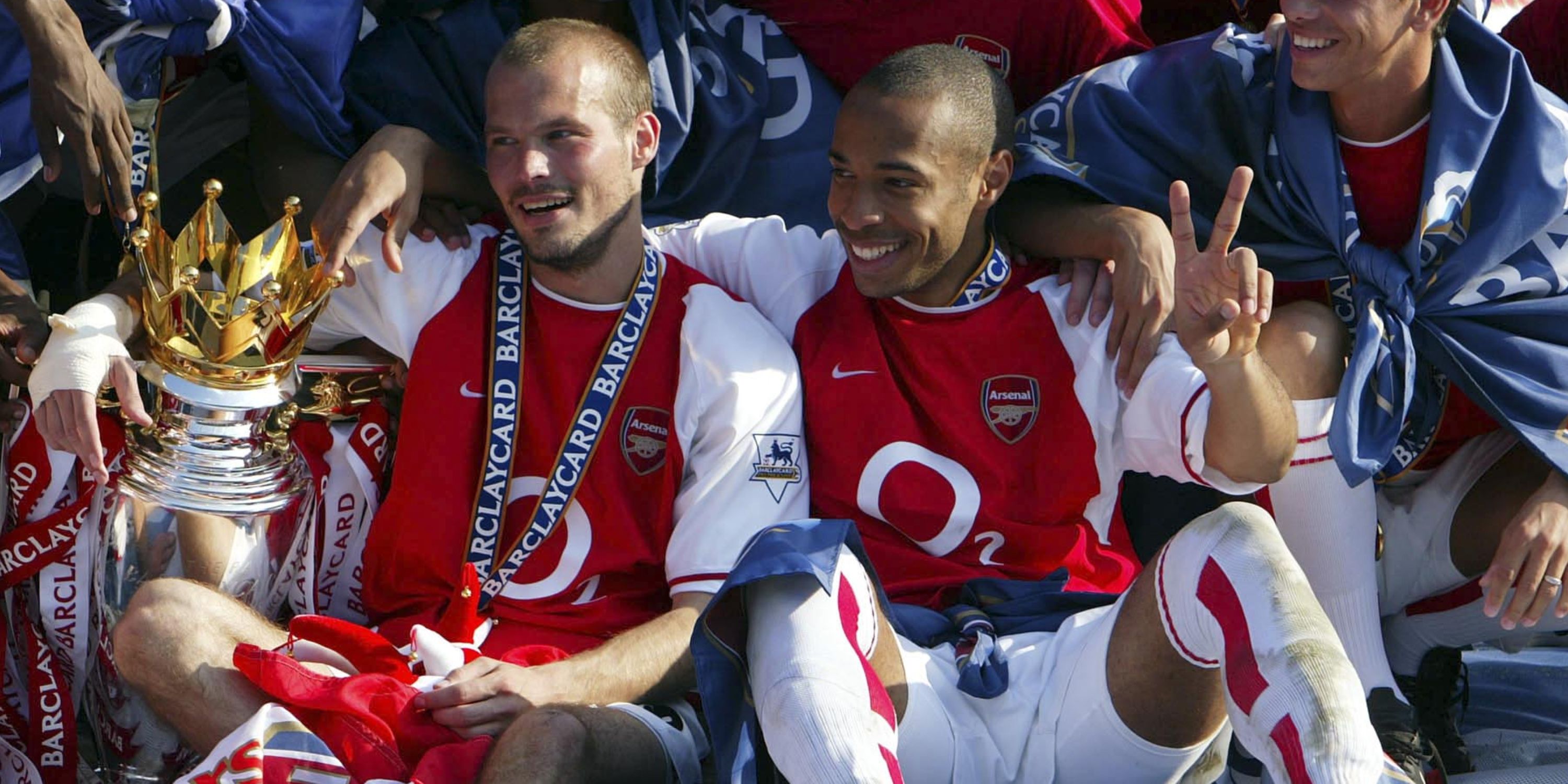 Freddie Ljungberg and Thierry Henry celebrating Arsenal's Premier League title triumph