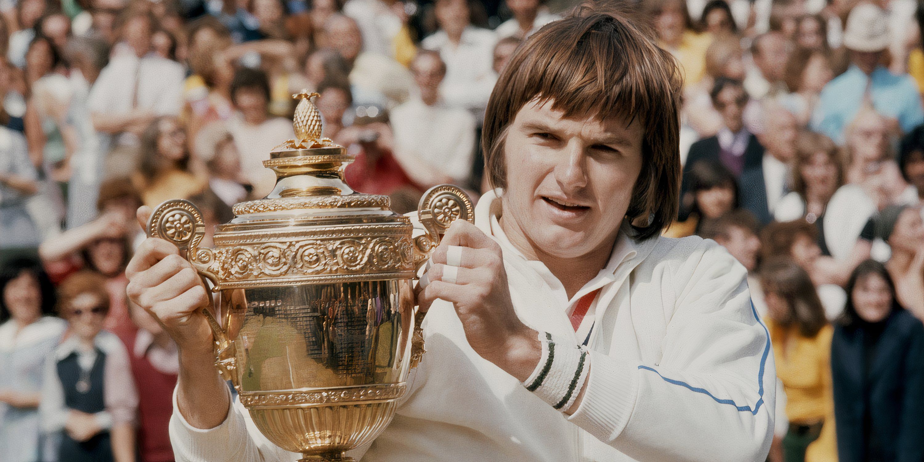 Jimmy Connors lifts the Wimbledon trophy