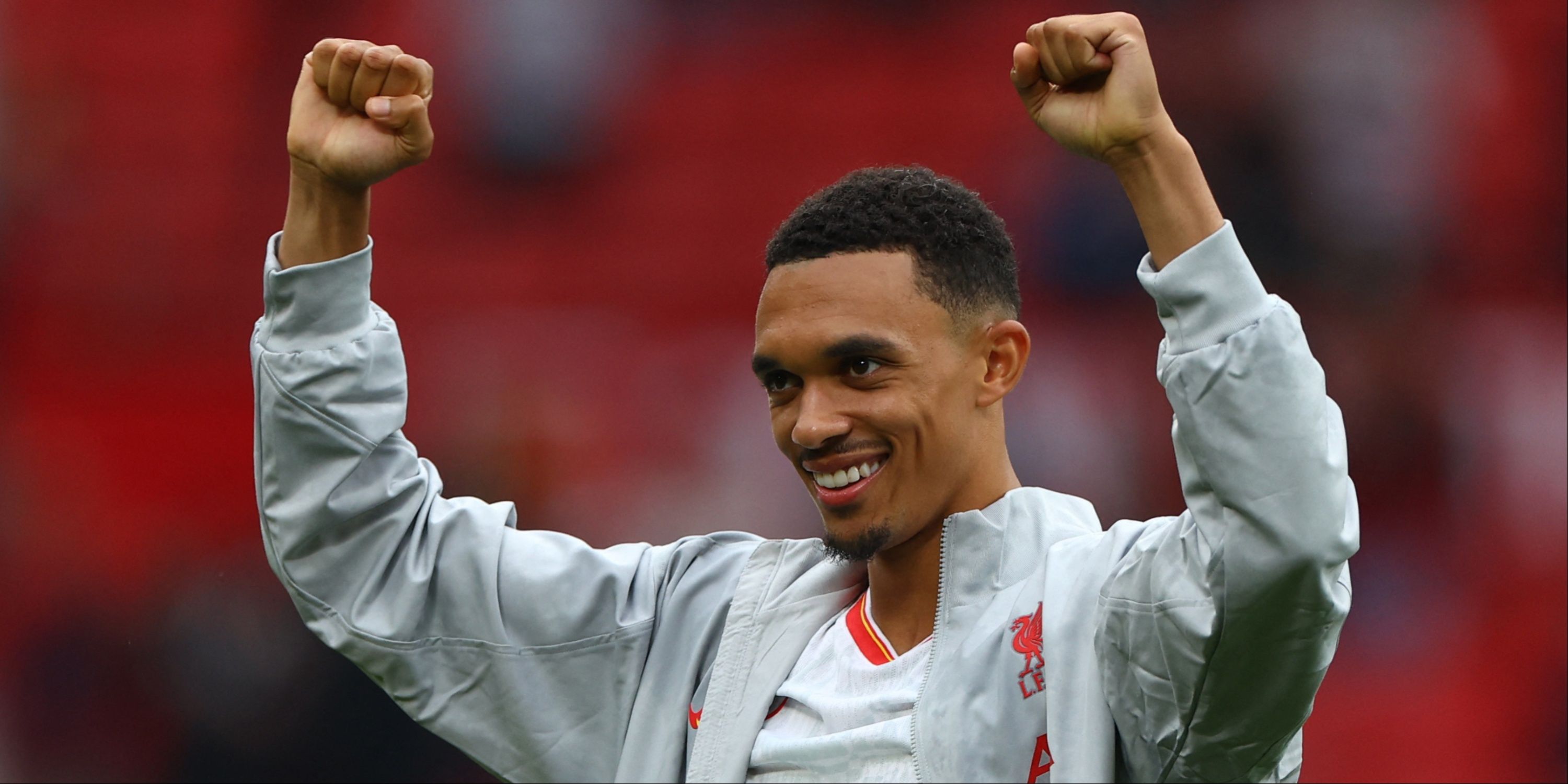 Trent Alexander-Arnold with arms raised