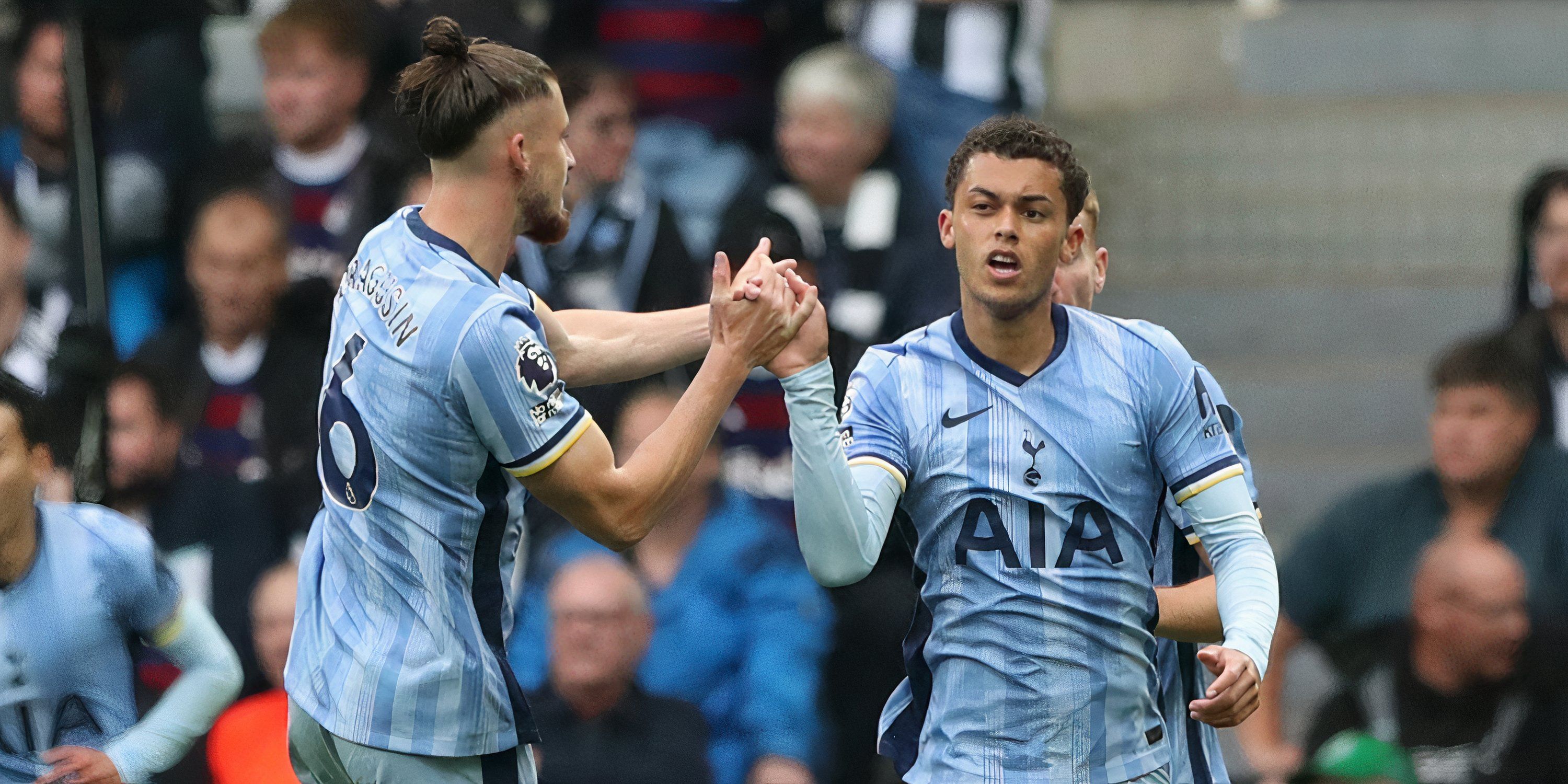 Tottenham Hotspur's Radu Dragusin and Brennan Johnson celebrates their first goal, an own goal scored by Newcastle United's Dan Burn