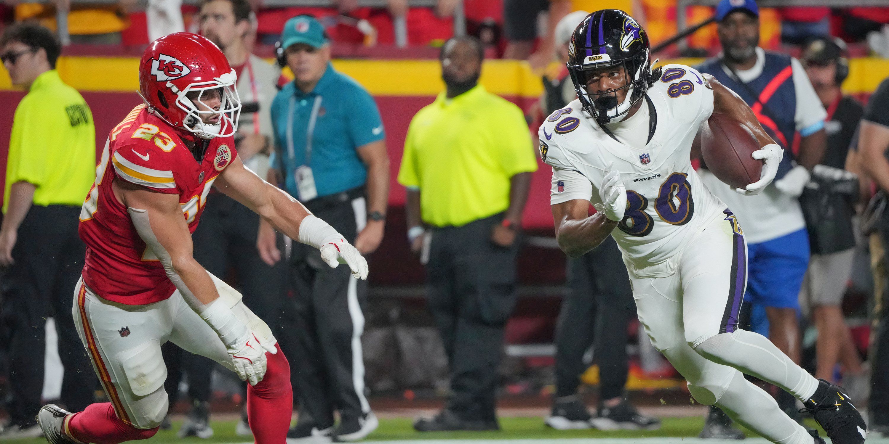 Kansas City, Missouri, USA; Baltimore Ravens tight end Isaiah Likely (80) runs the ball as Kansas City Chiefs linebacker Drue Tranquill (23) defends during the first half at GEHA Field at Arrowhead Stadium