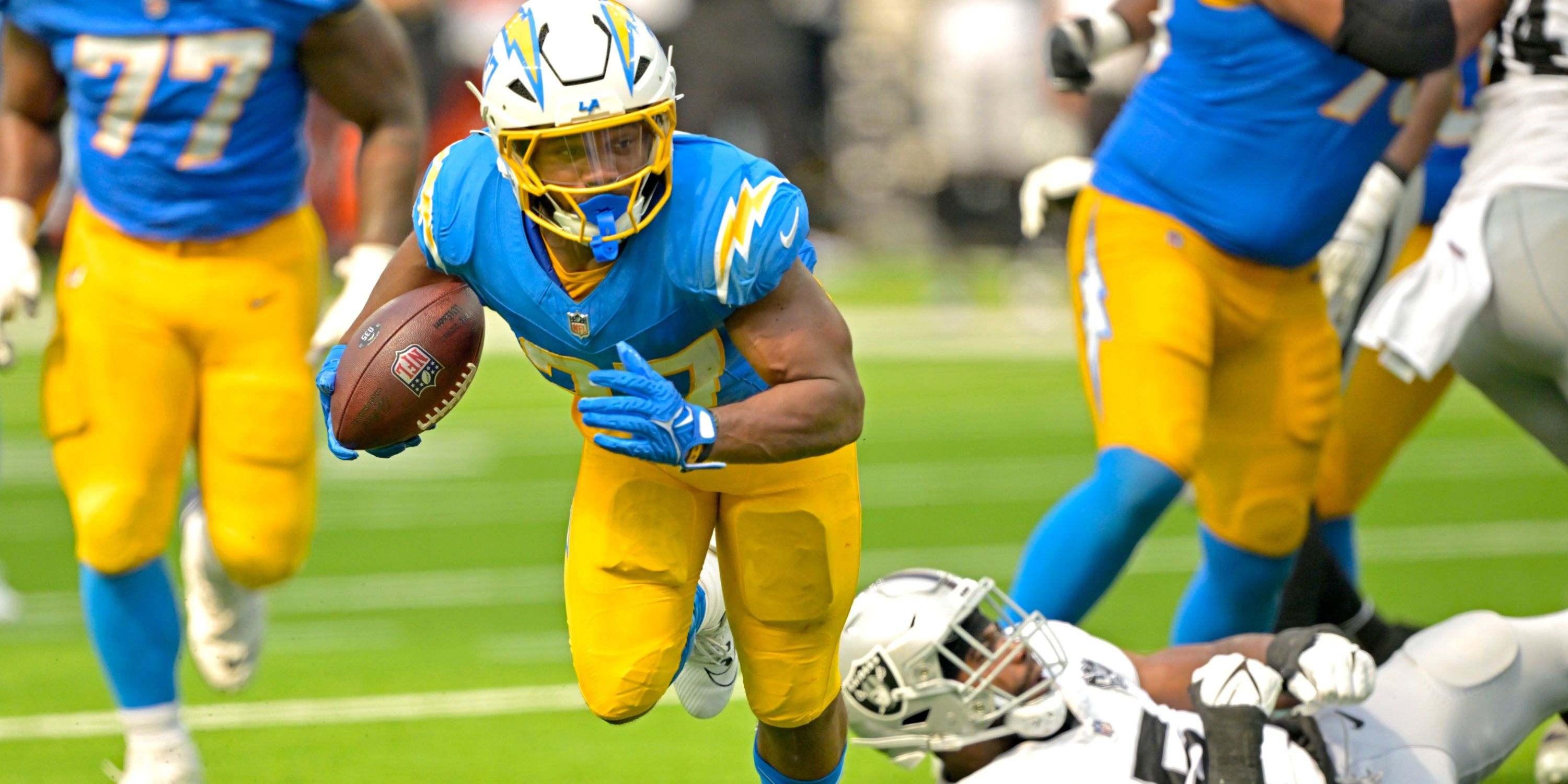 Chargers RB J.K. Dobbins runs against Raiders