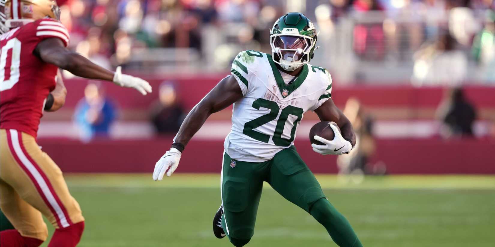 Jets RB Breece Hall runs with football