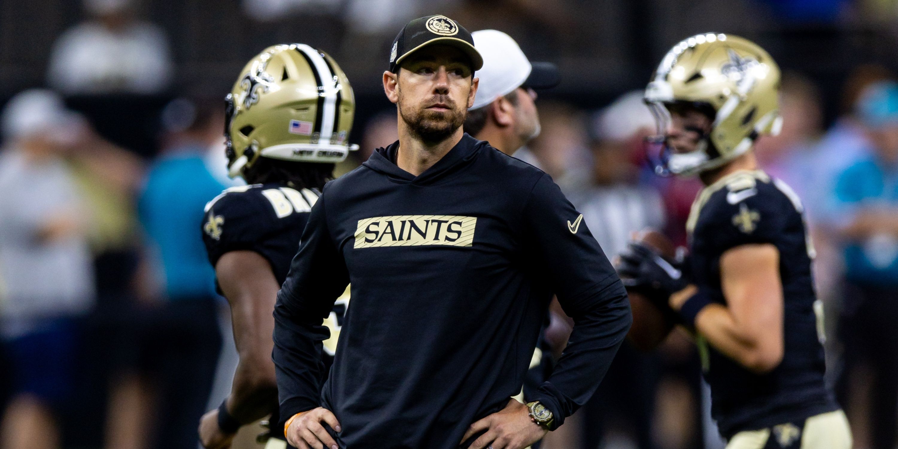 Saints Offensive Coordinator Klint Kubiak on the field before the game