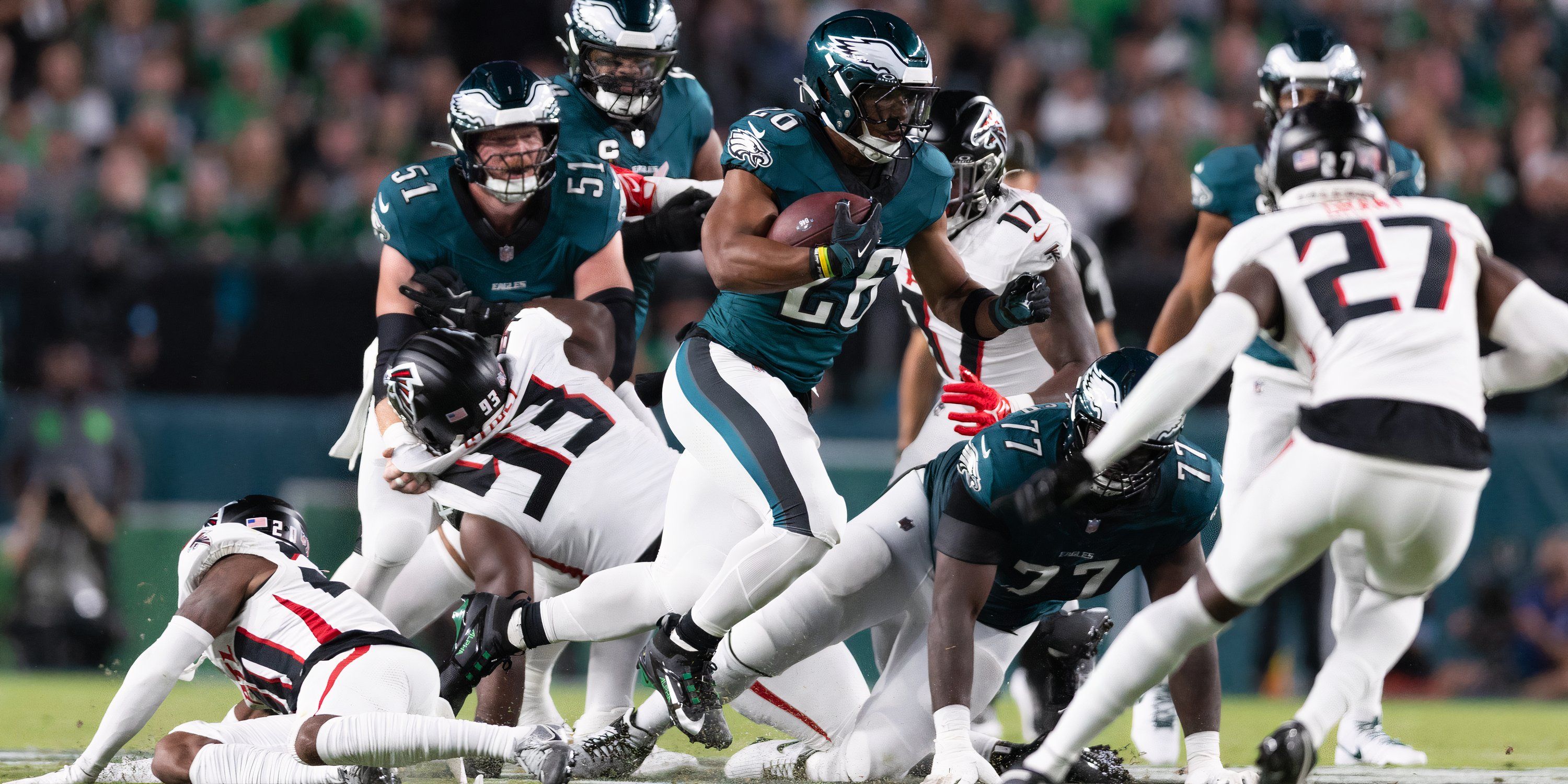  Philadelphia Eagles running back Saquon Barkley (26) runs with the ball against the Atlanta Falcons during the first quarter at Lincoln Financial Field.