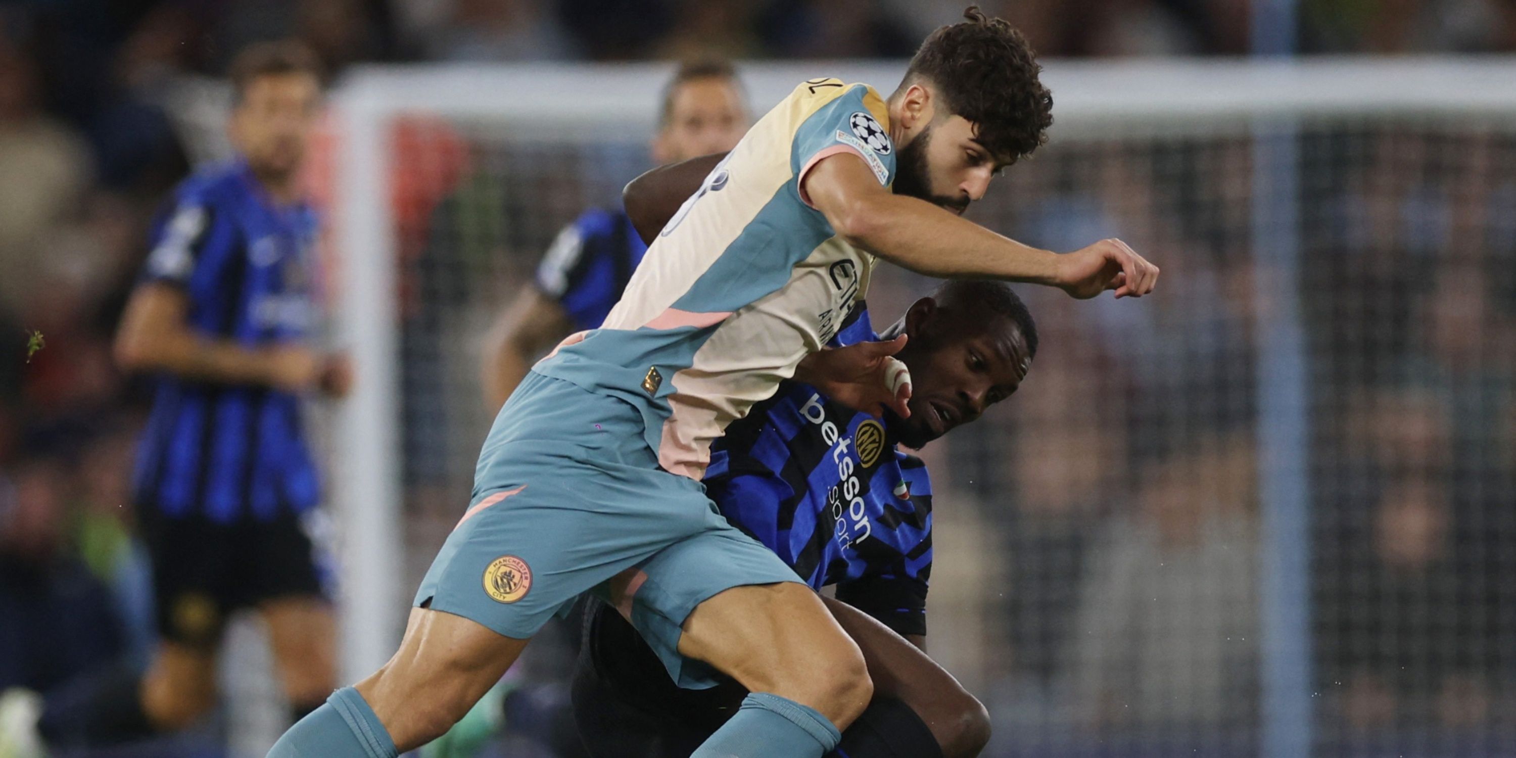 Manchester City's Josko Gvardiol in action with Inter Milan's Marcus Thuram