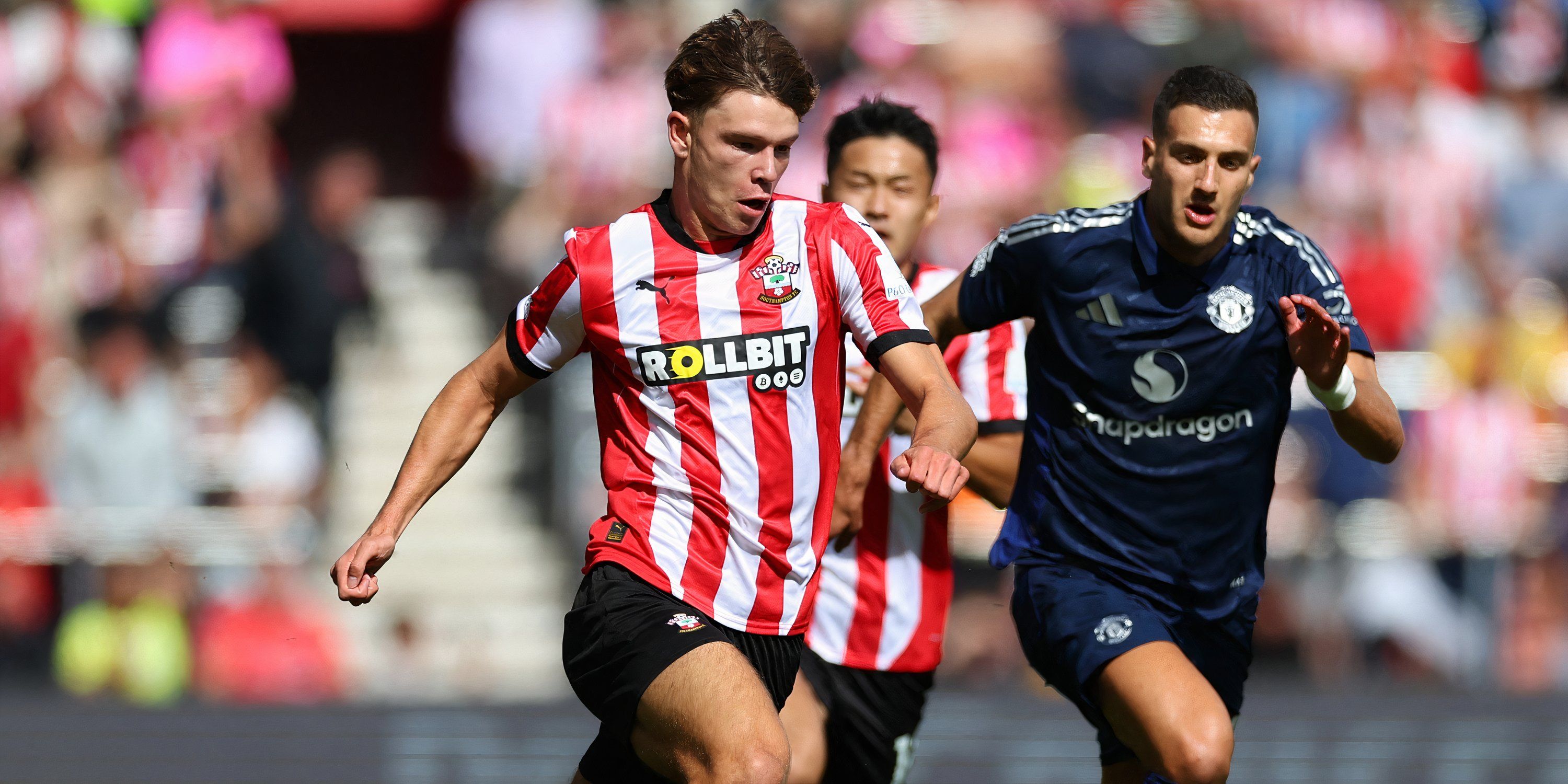 Southampton winger Tyler Dibling breaking away from Manchester United full-back Diogo Dalot