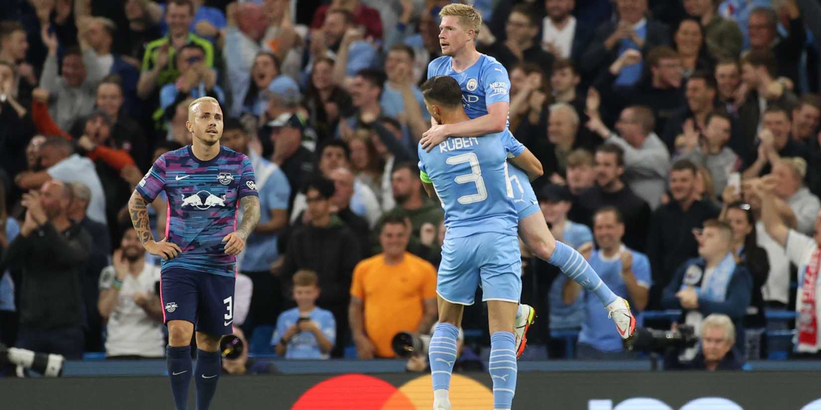 Manchester City's Ruben Dias and Kevin De Bruyne celebrates their second goal, an own goal scored by RB Leipzig's Nordi Mukiele