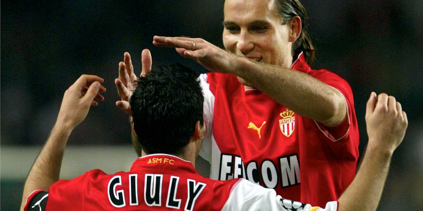 Monaco's Dado Prso (R) celebrates with Monaco team captain Ludovic Giuly (L) the team's seventh goal against Deportivo La Coruna, during their Champions League Group stage C match in Monaco November 5, 2003