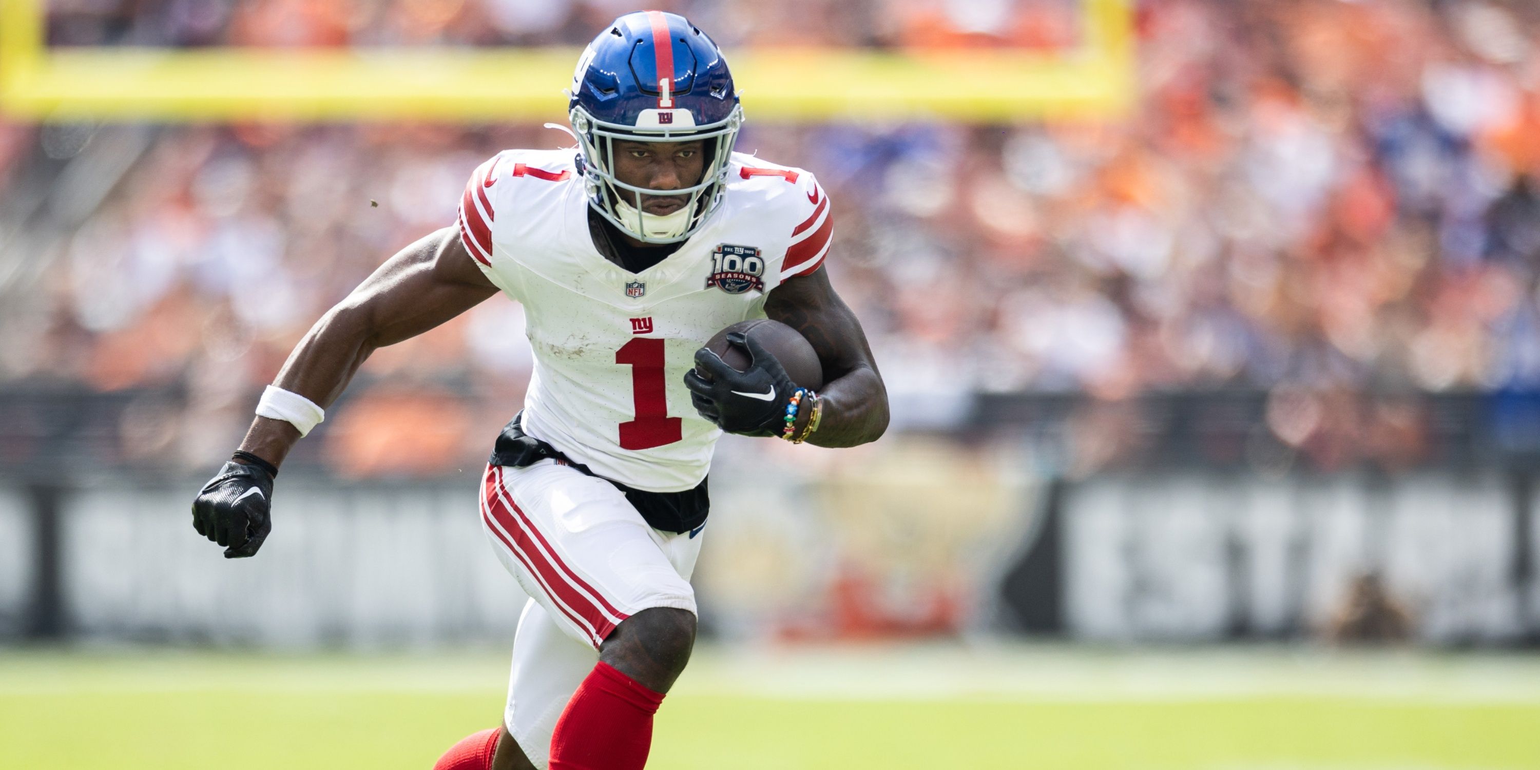 Giants WR Malik Nabers carries the ball
