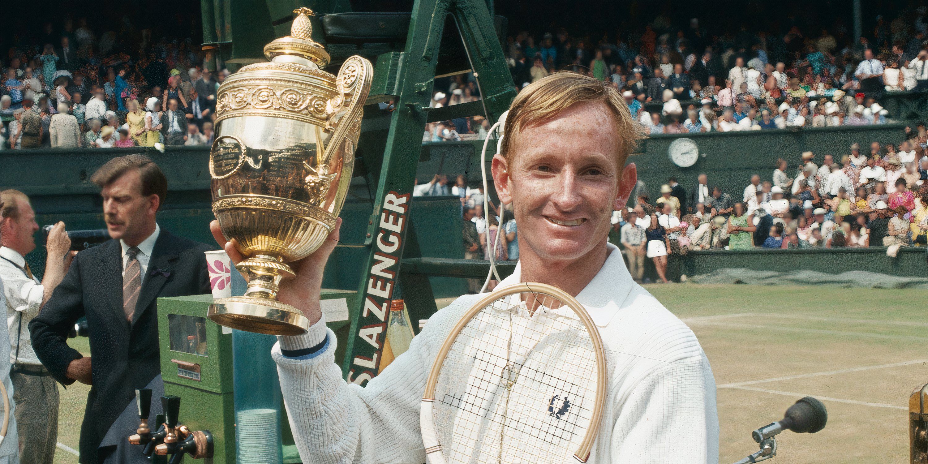 Rod Laver lifts the Wimbledon trophy