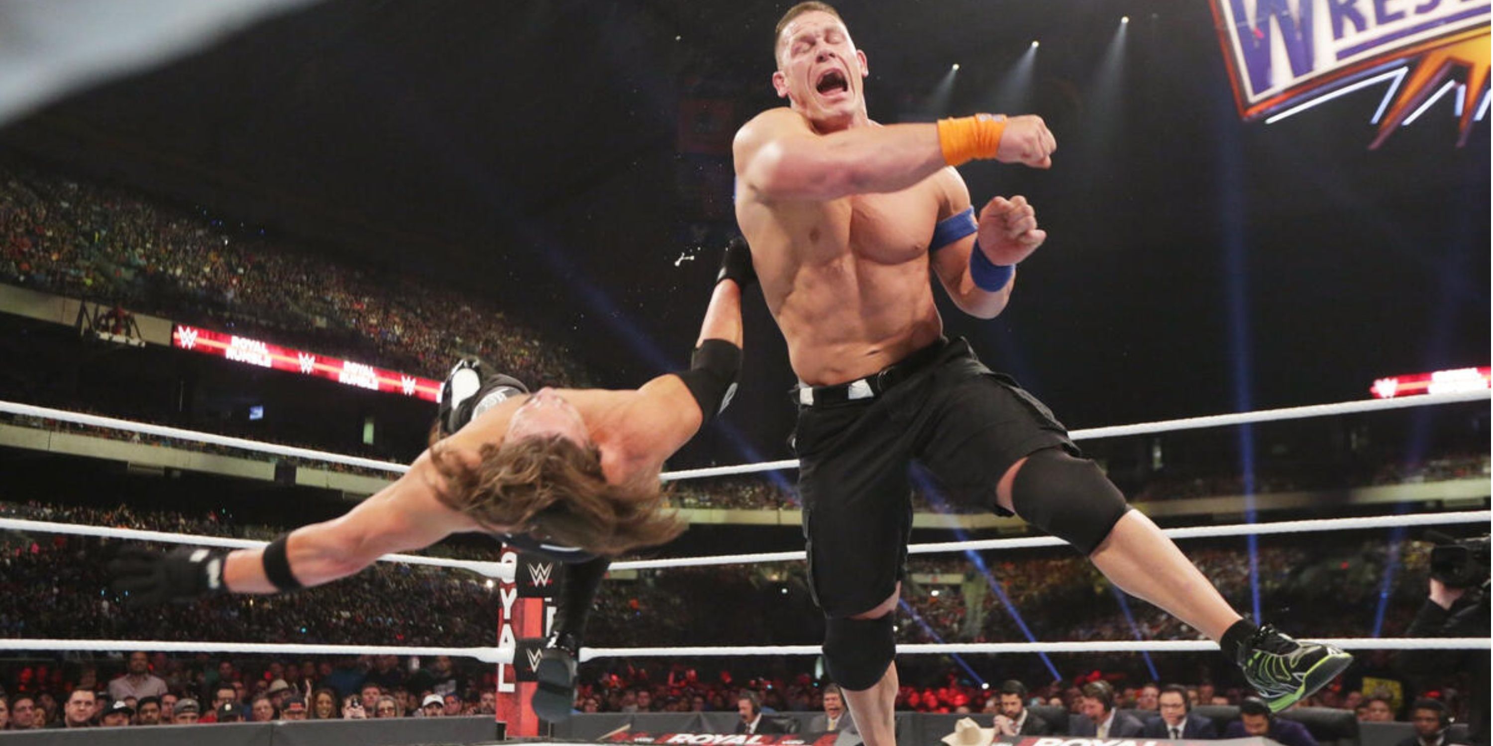 John Cena hitting a clothesline on AJ Styles at the 2017 Royal Rumble pay-per-view