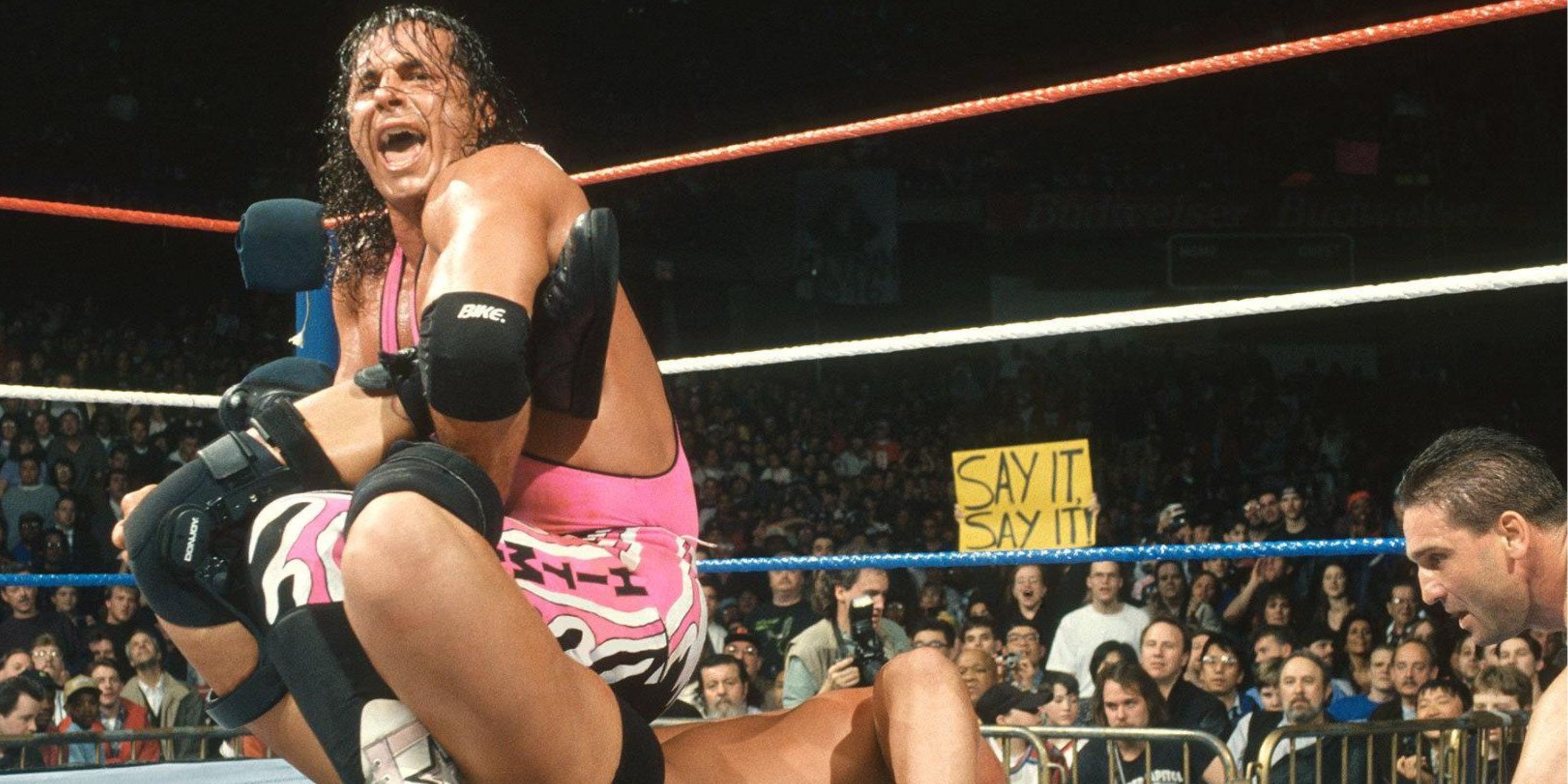 Bret Hart applying a Sharpshooter to Steve Austin