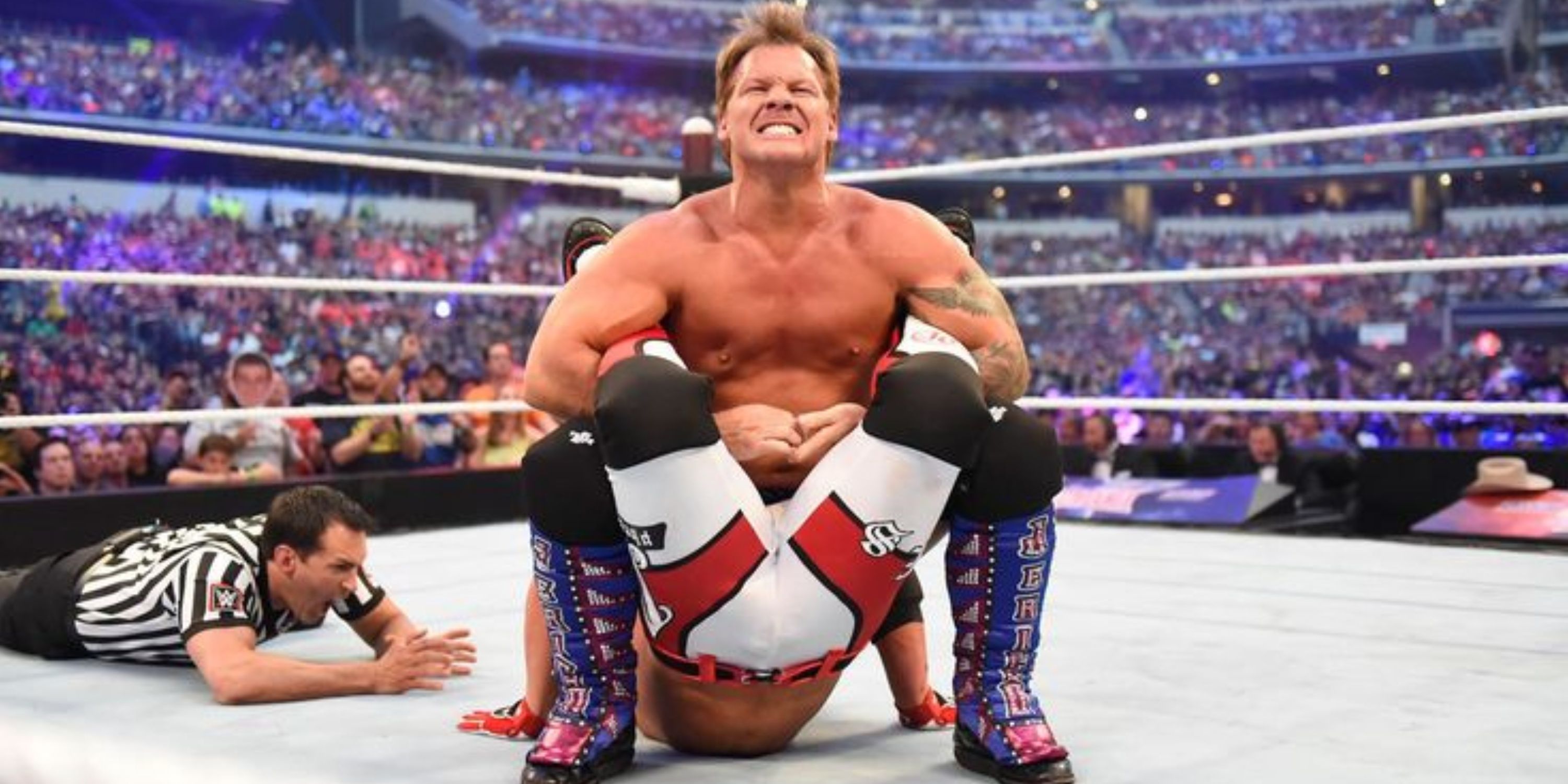 Chris Jericho applying the Walls of Jericho to AJ Styles at WrestleMania 32