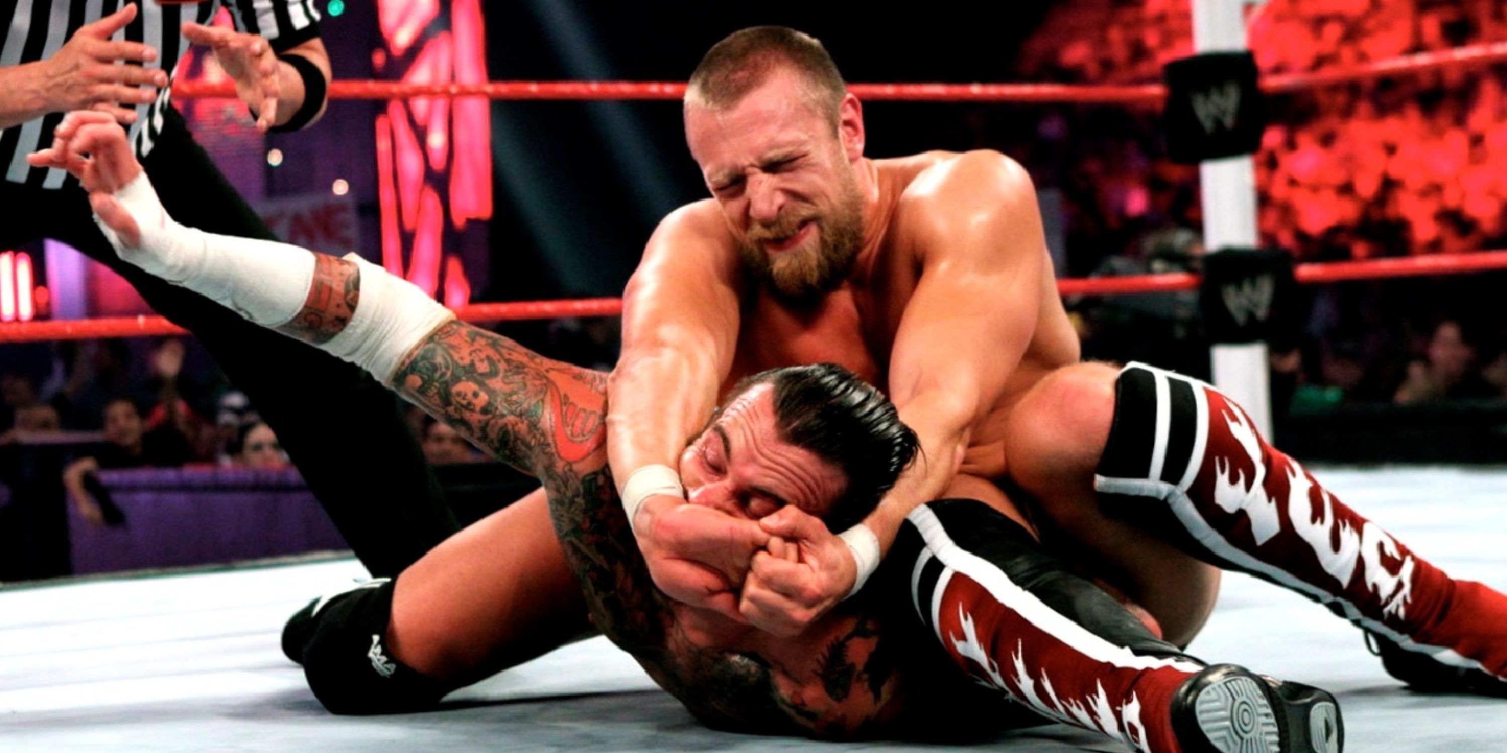 Daniel Bryan applying the LeBell Lock to CM Punk