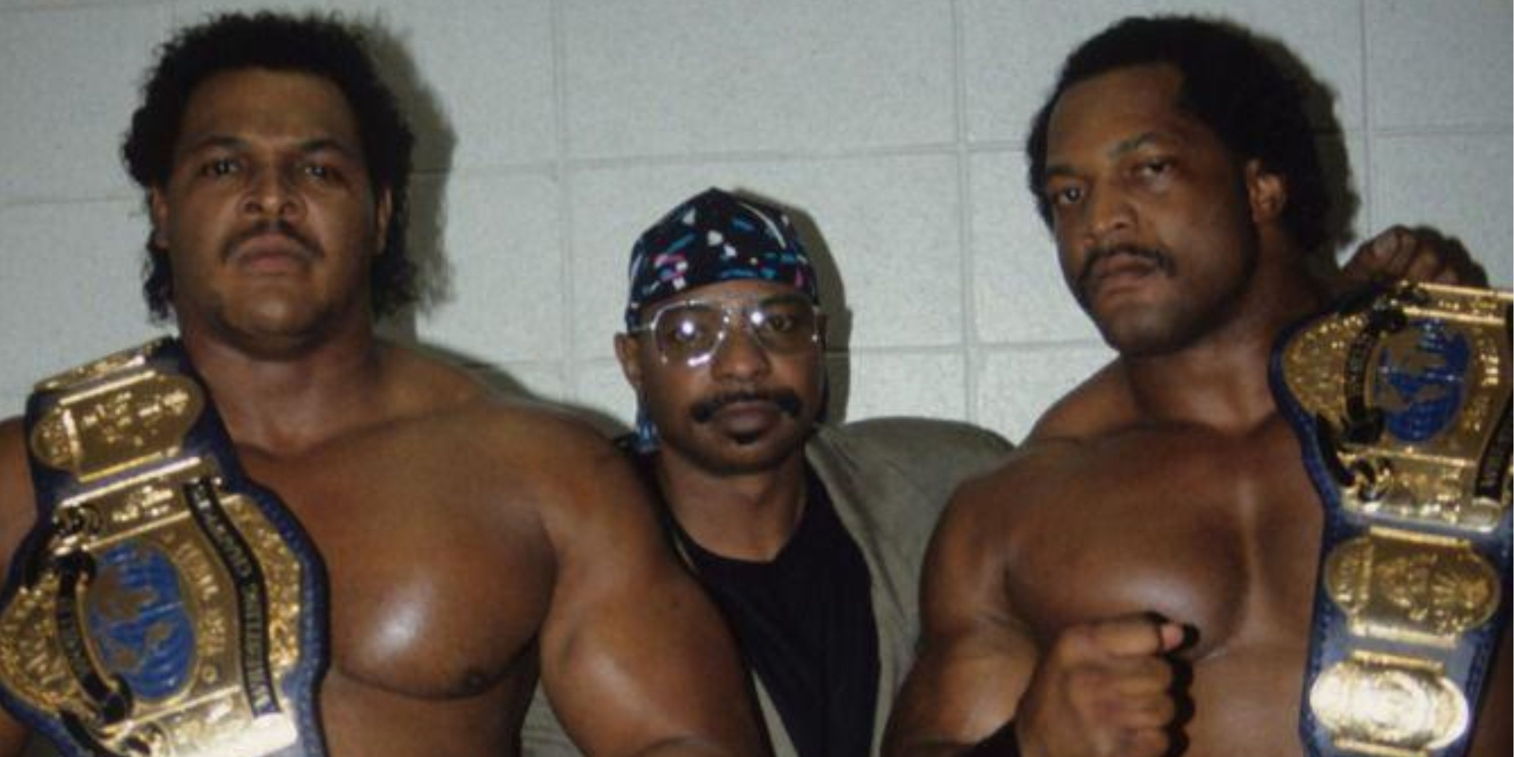 Doom with Teddy Long as WCW World Tag Team Champions