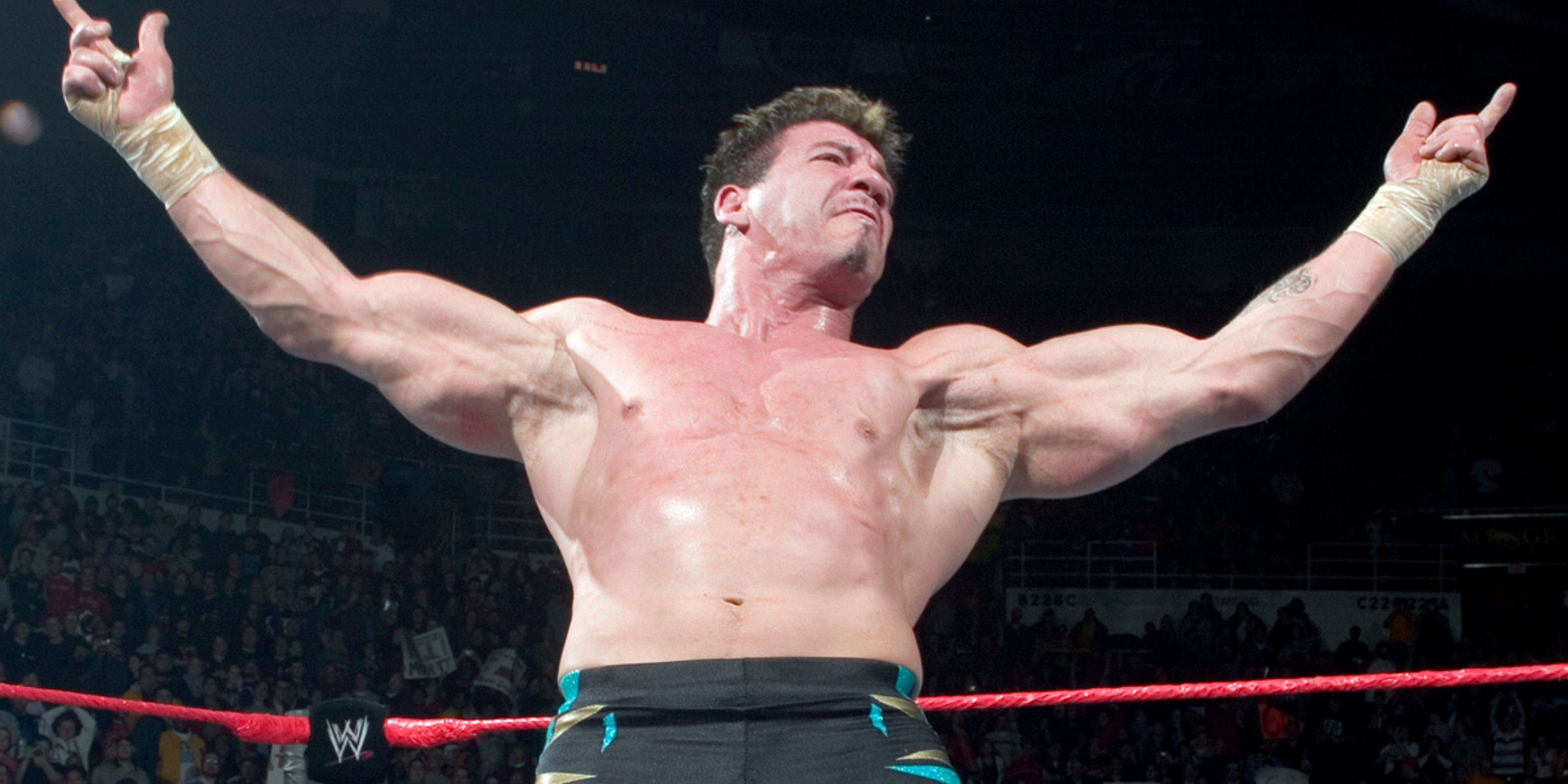 Eddie Guerrero poses in a WWE ring