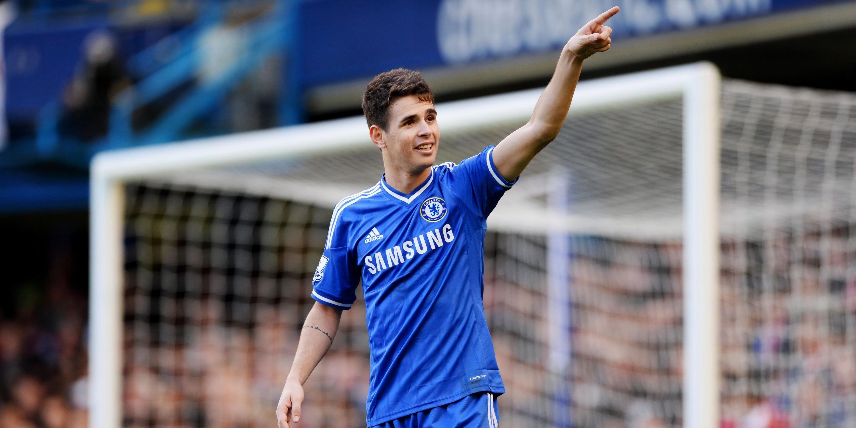 Oscar celebrates a goal for Chelsea.