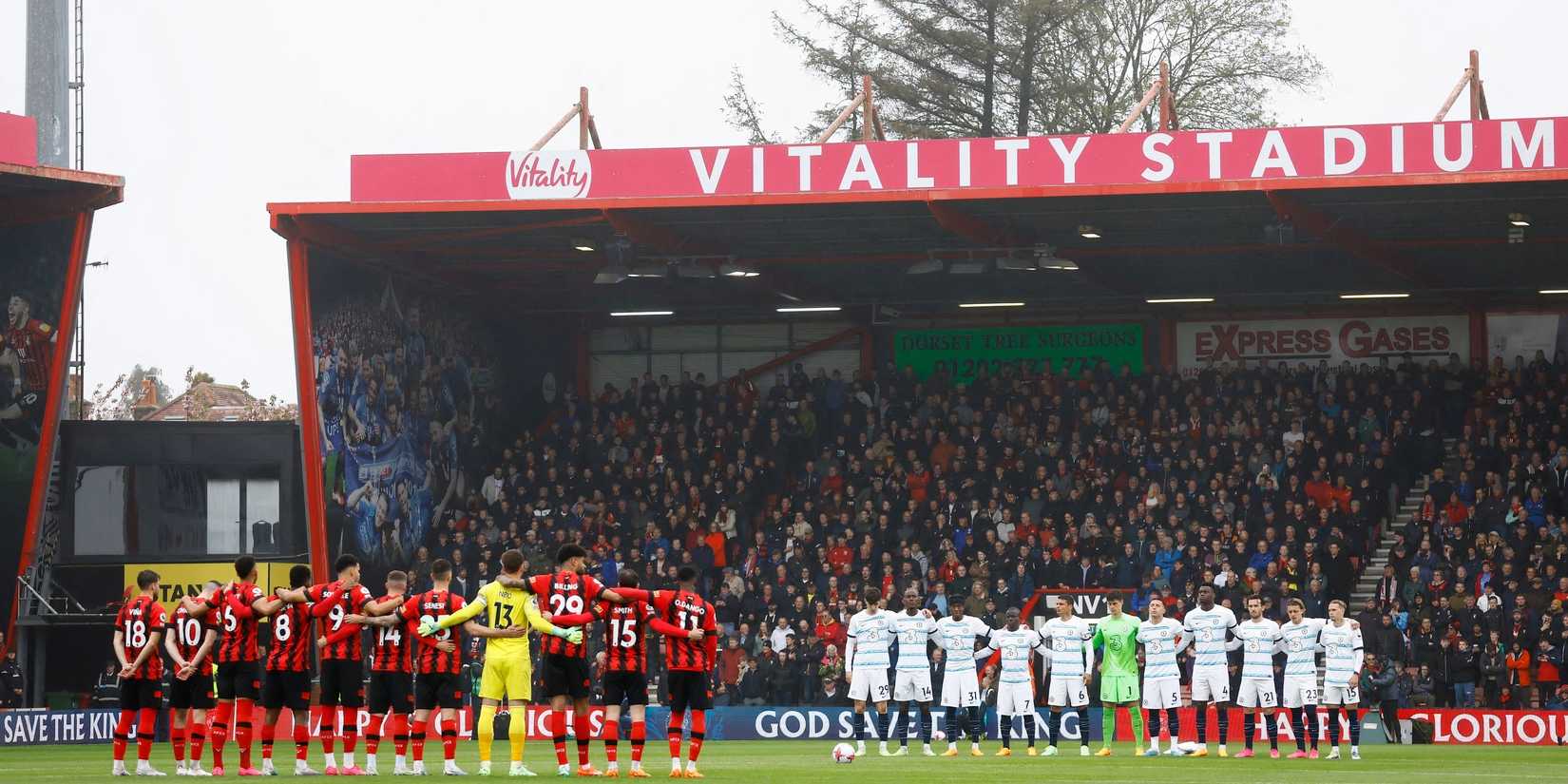 Bournemouth and Chelsea players stand for the national anthem before a game at the Vitality Stadium.