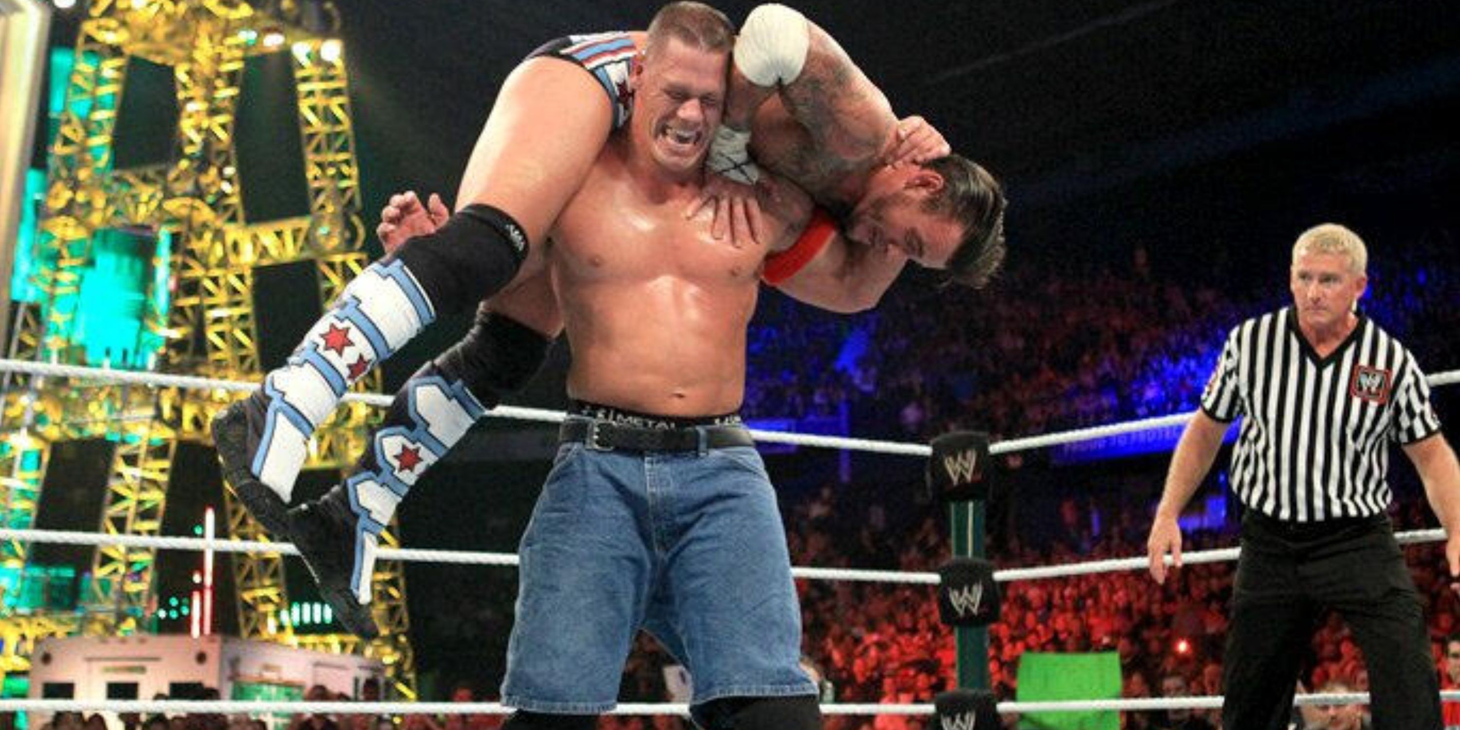 John Cena with CM Punk on his shoulders at Money in the Bank 2011