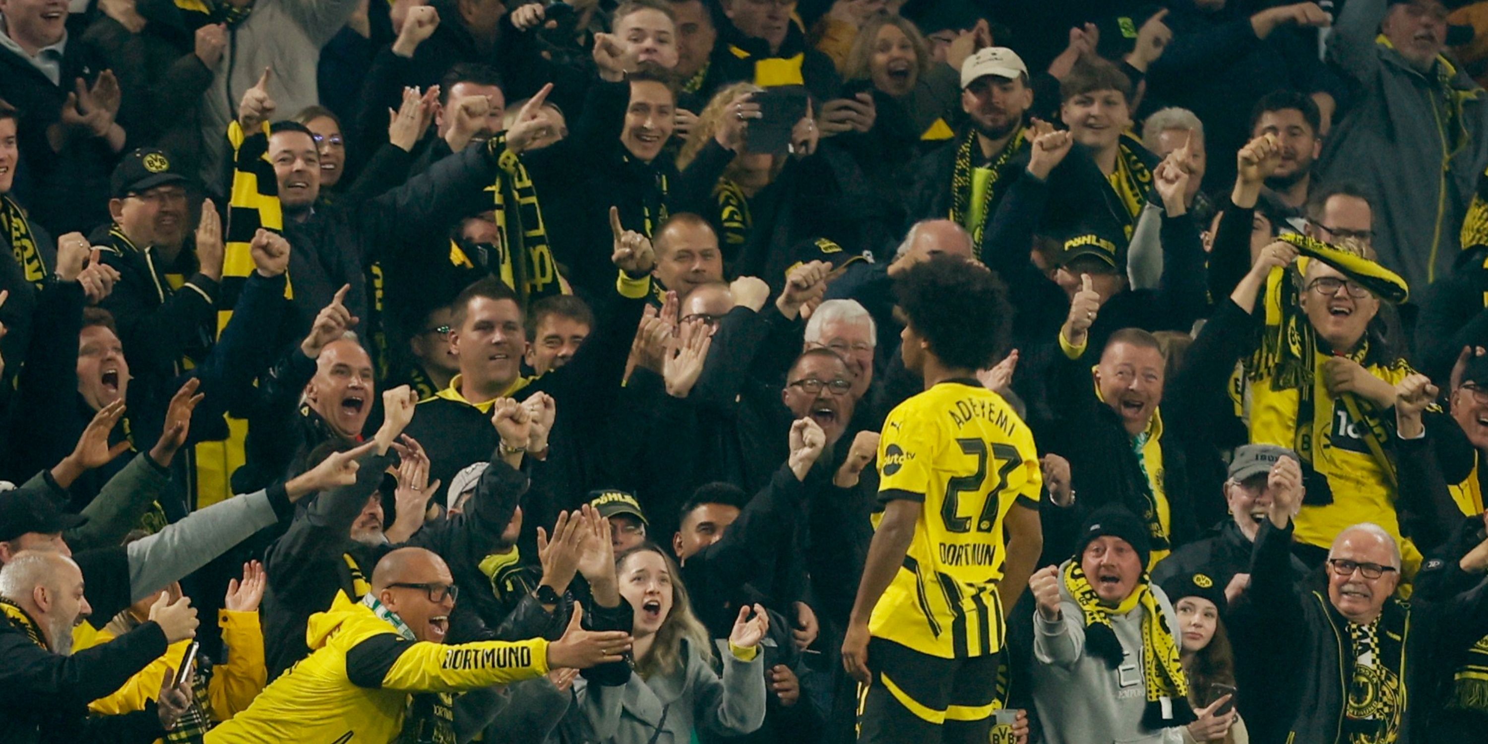 orussia Dortmund's Karim Adeyemi celebrates scoring their second goal in front of fans