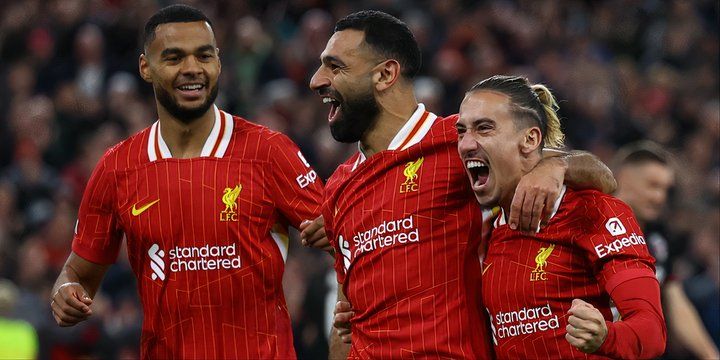 Mo Salah, Cody Gakpo and Kostas Tsimikas celebrate a Liverpool goal vs Bologna