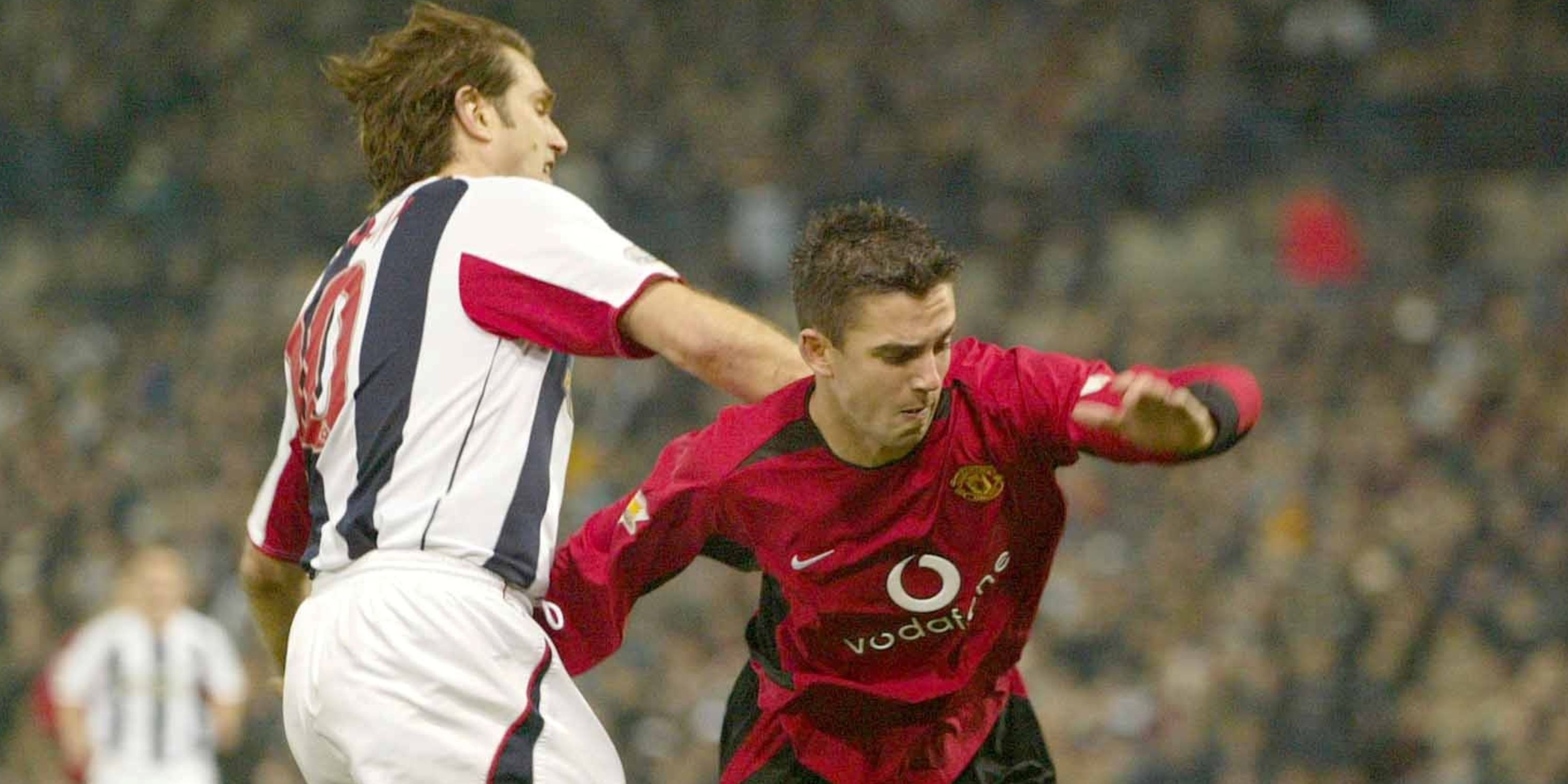 United's Paul Tierney is challenged by West Brom's Andy Johnson